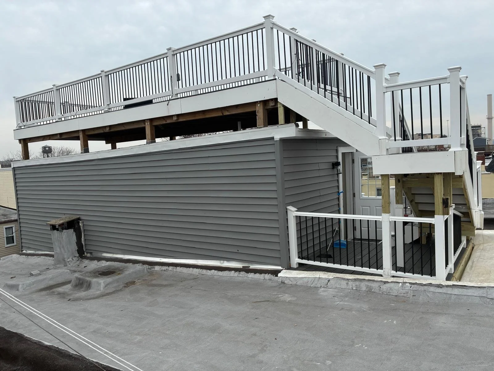 Custom Deck, Roof Deck, Vinyl Hand rails, composite boards, door deck, deck builder, deck engineering, deck builder in NYC, deck builder in Baltimore, Deck builder in New Jersey.