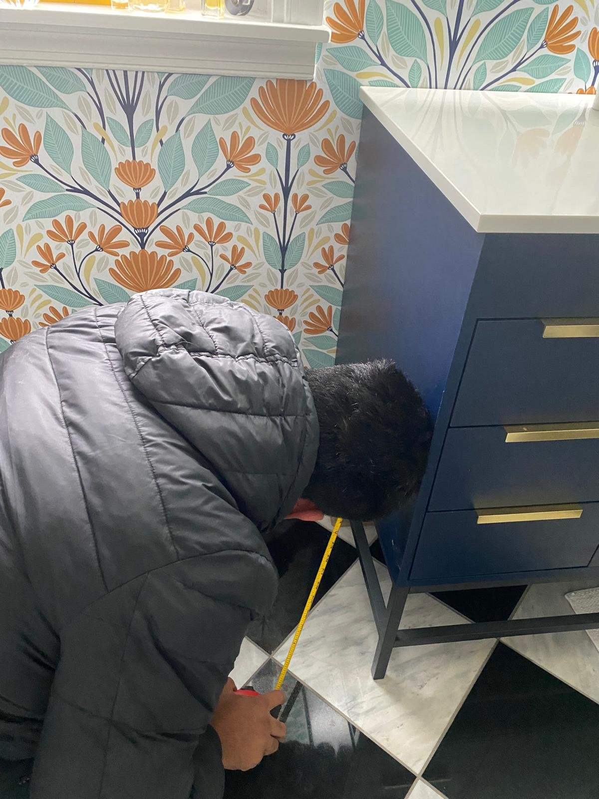 Minimalist bathroom sink with professional faucet fitting. Clean lines and superior finishes for homes in Brick Township.