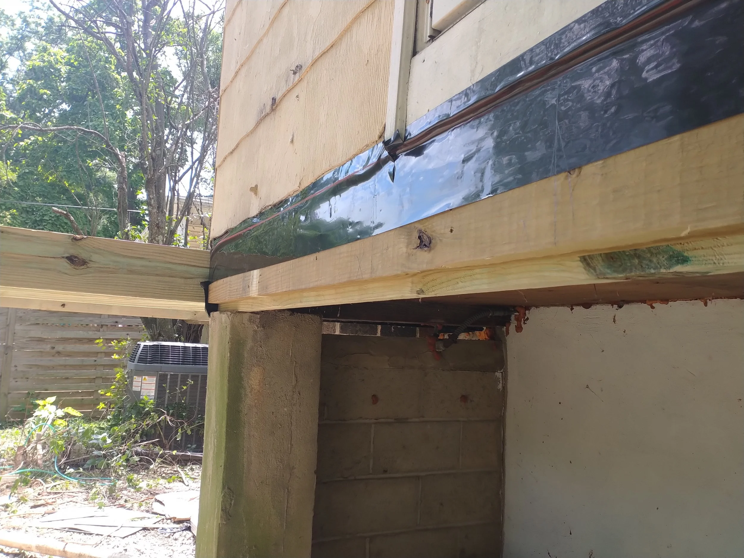 Structural elevated deck framing with pressure-treated lumber. Expert outdoor construction in Point Pleasant Beach, NJ. Custom wood deck construction project in Middletown. High-quality pressure-treated lumber and professional framing. Custom Deck, R