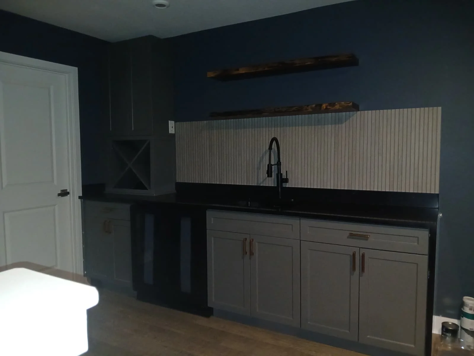 Custom Bar & Cabinetry Installation – Interior Renovation

This project features a fully custom-built bar and cabinetry installation designed to combine modern aesthetics with everyday functionality. The space includes custom gray shaker-style cabine