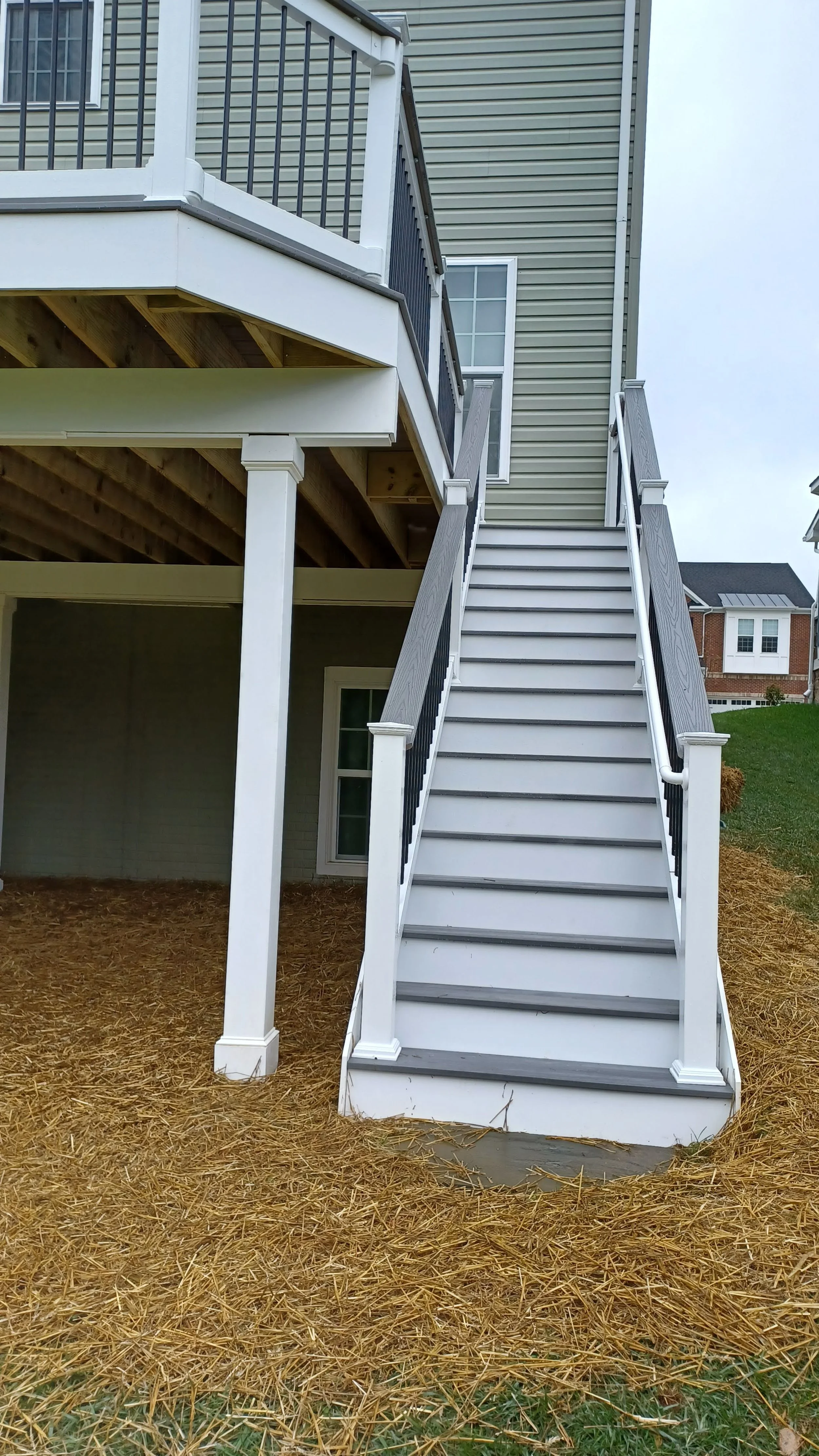 Structural elevated deck framing with pressure-treated lumber. Expert outdoor construction in Point Pleasant Beach, NJ. Custom wood deck construction project in Middletown. High-quality pressure-treated lumber and professional framing. Custom Deck, R