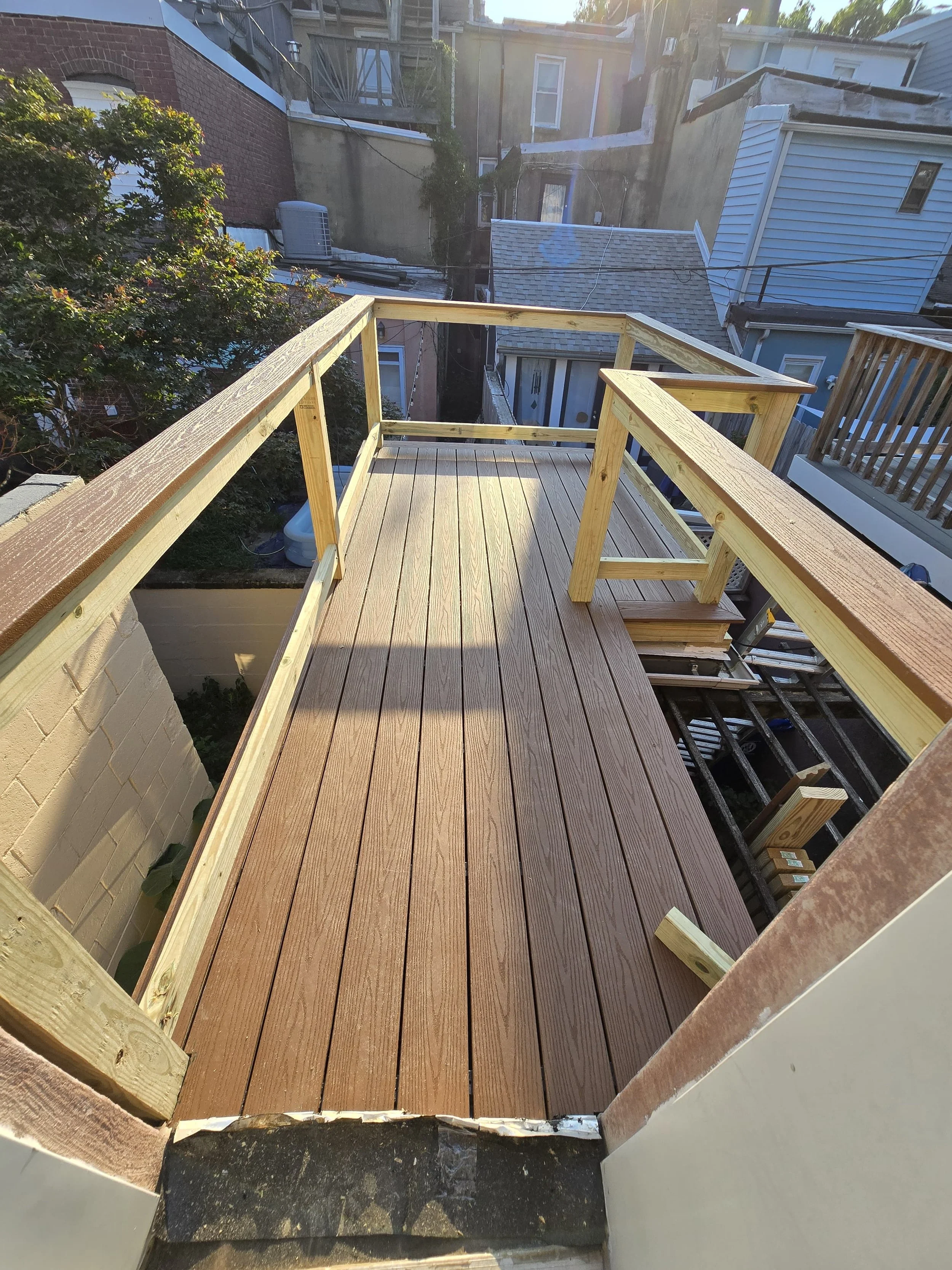 Custom wood deck construction project in Middletown. High-quality pressure-treated lumber and professional framing. Custom Deck, Roof Deck, Vinyl Hand rails, composite boards, door deck, deck builder, deck engineering, deck builder in NYC, deck build