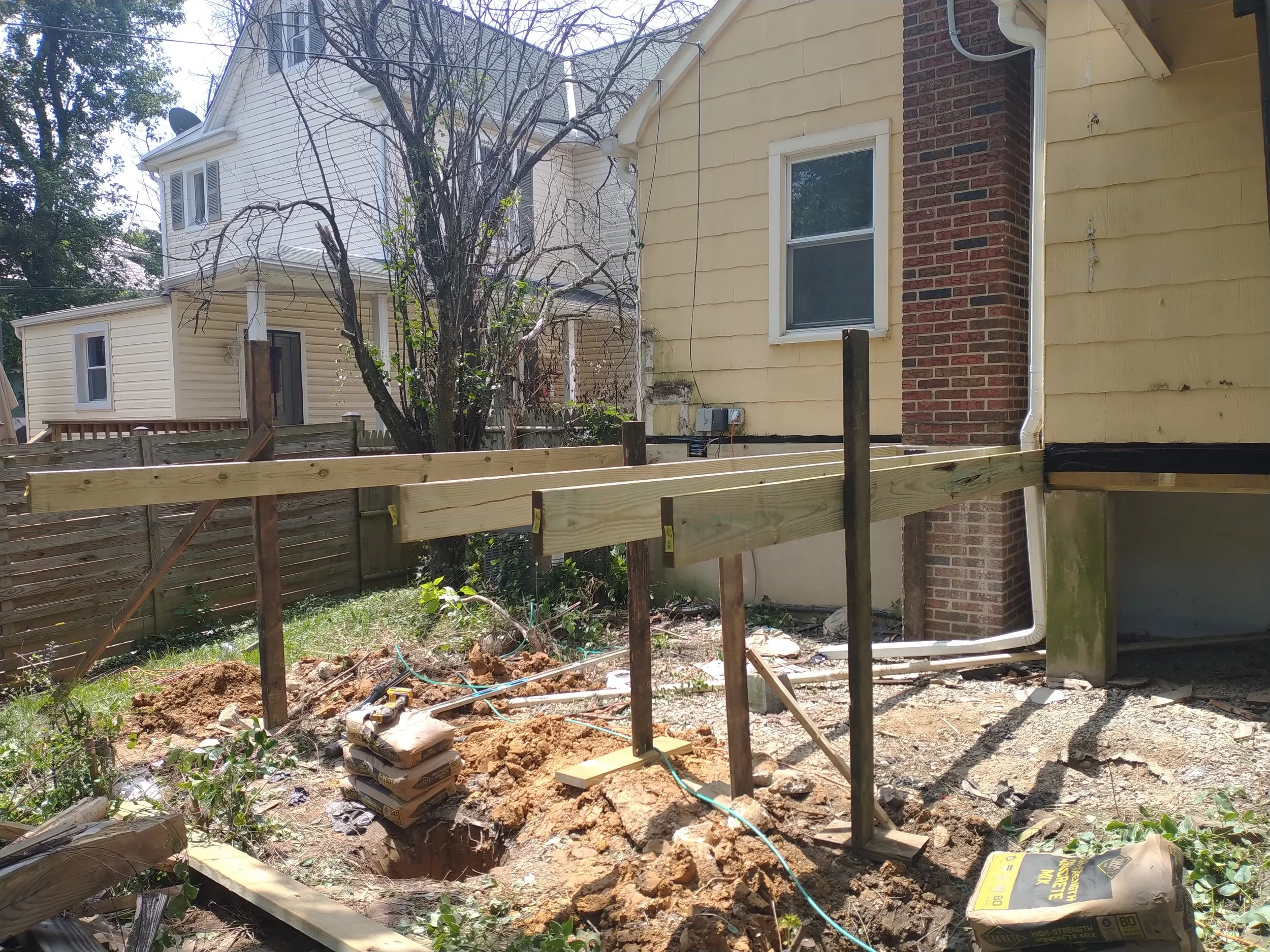 Structural elevated deck framing with pressure-treated lumber. Expert outdoor construction in Point Pleasant Beach, NJ. Custom wood deck construction project in Middletown. High-quality pressure-treated lumber and professional framing. Custom Deck, R