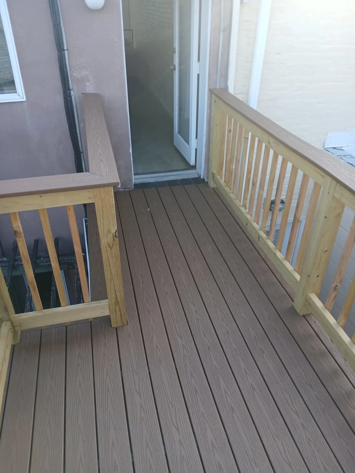 Full view of a finished backyard deck remodel. Elite Craft Construction delivering premium outdoor results in Middletown.