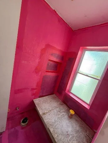 Custom modern bathroom vanity with dual mirror installation. Premium cabinetry and lighting design for homes in Annapolis, MD.