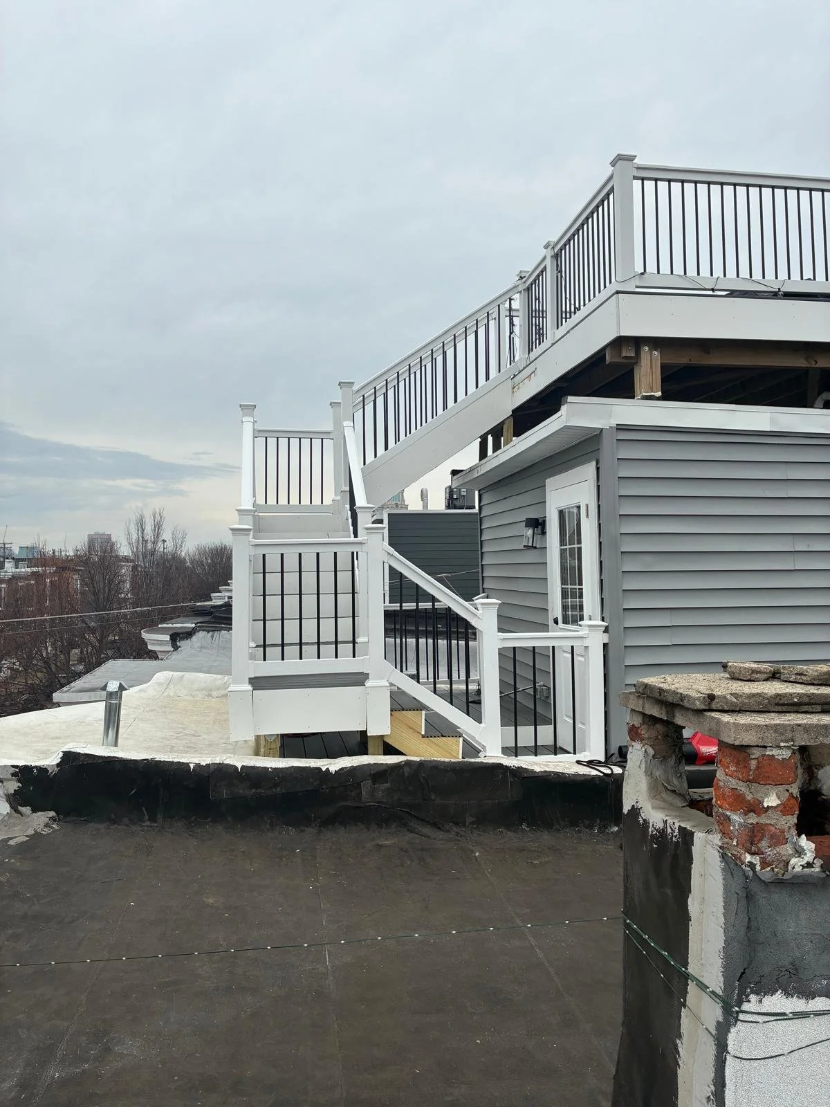 Custom Deck, Roof Deck, Vinyl Hand rails, composite boards, door deck, deck builder, deck engineering, deck builder in NYC, deck builder in Baltimore, Deck builder in New Jersey.