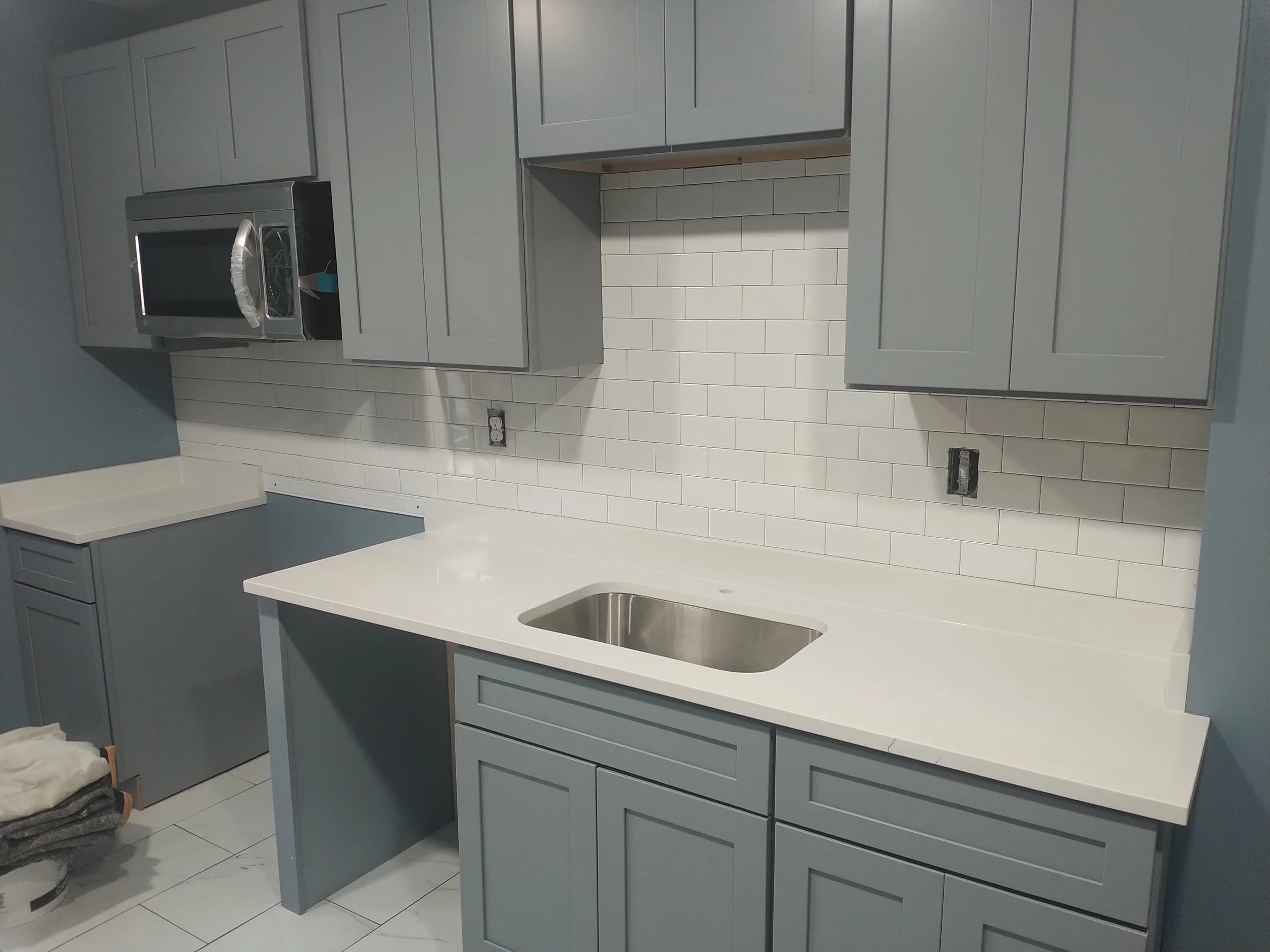 Innovative integrated laundry and kitchen renovation. Smart space optimization and high-end design for modern living in Bethesda, MD.