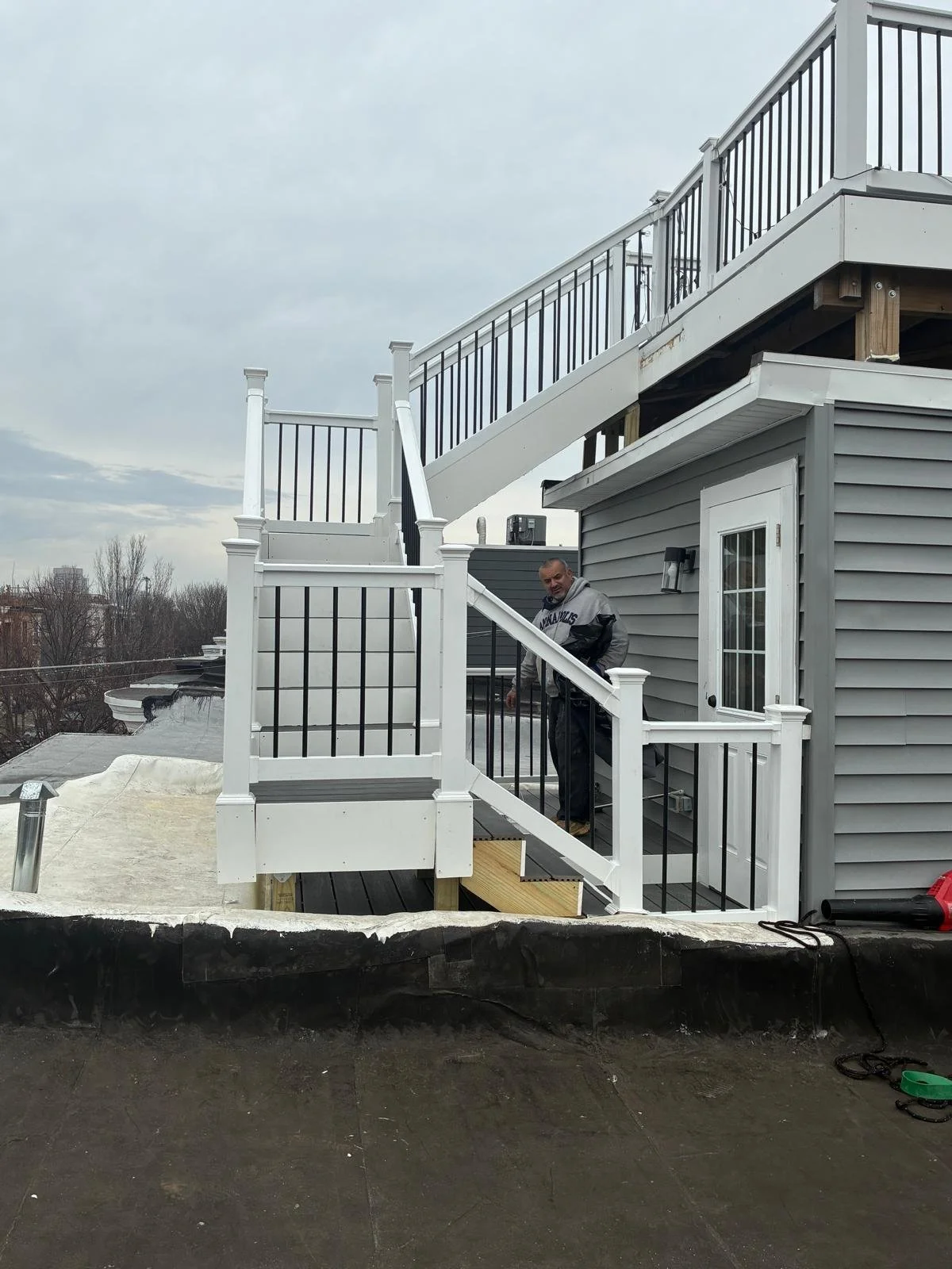 Custom Deck, Roof Deck, Vinyl Hand rails, composite boards, door deck, deck builder, deck engineering, deck builder in NYC, deck builder in Baltimore, Deck builder in New Jersey.