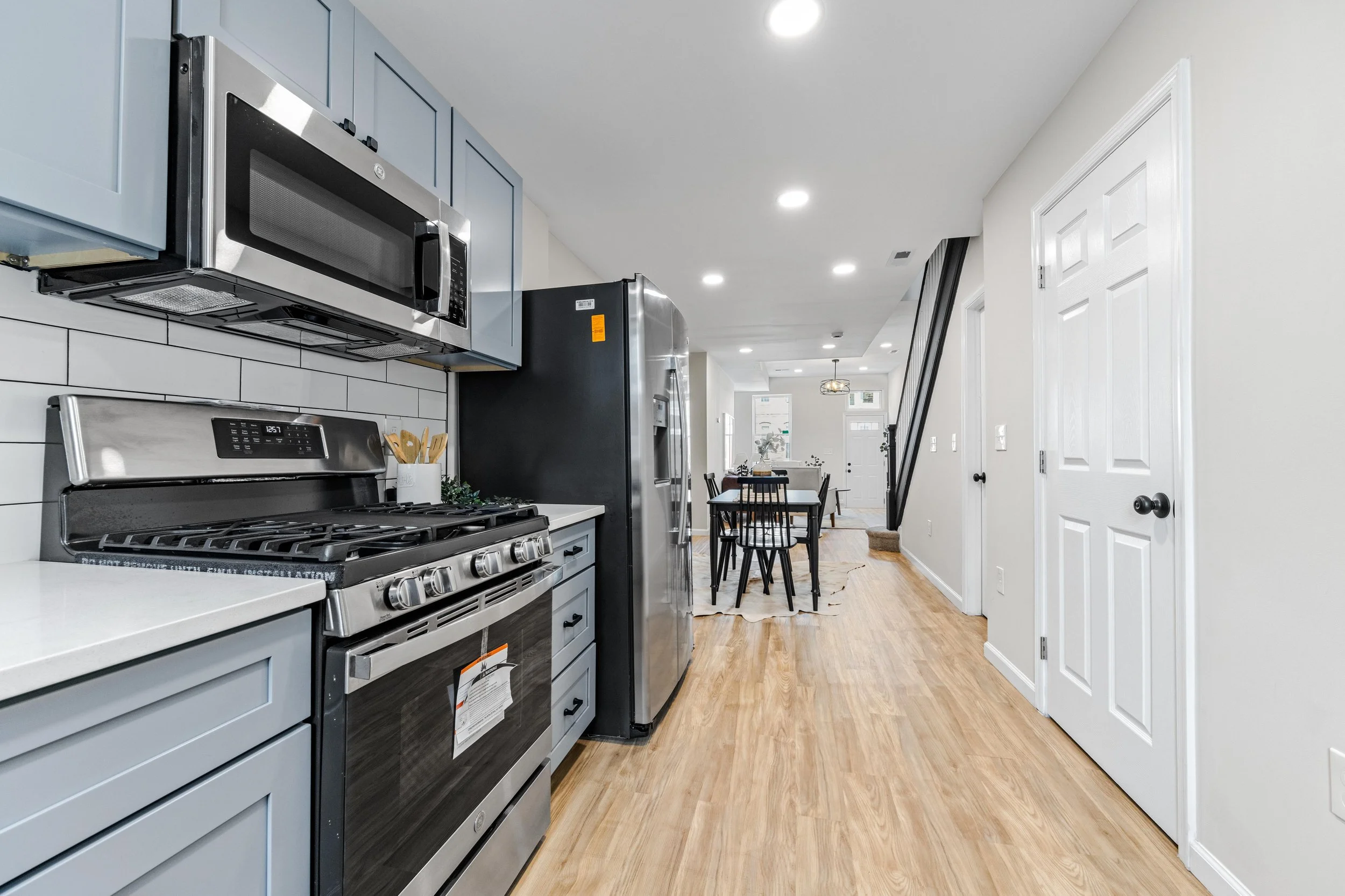 Luxury kitchen remodeling, Luxury vinyl floor, stainless steel appliances, reccesed lights