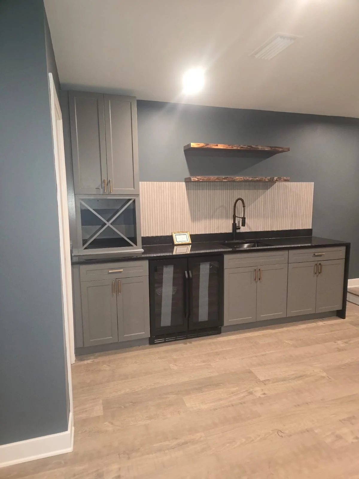 Custom Bar & Cabinetry Installation – Interior Renovation

This project features a fully custom-built bar and cabinetry installation designed to combine modern aesthetics with everyday functionality. The space includes custom gray shaker-style cabine