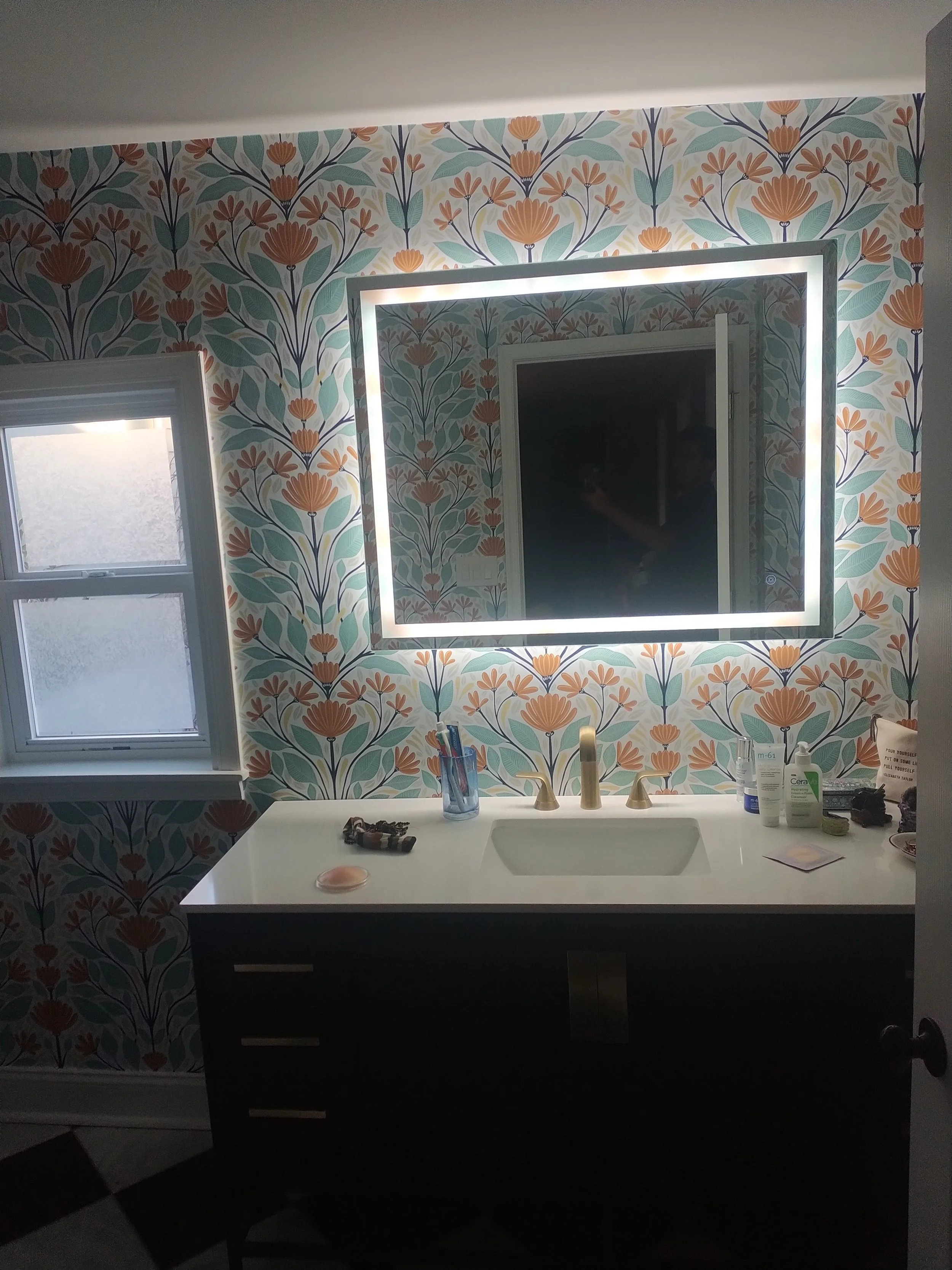 ustom floating vanity with dual mirrors and modern lighting. Premium bathroom cabinetry installation in Brick Township, NJ.