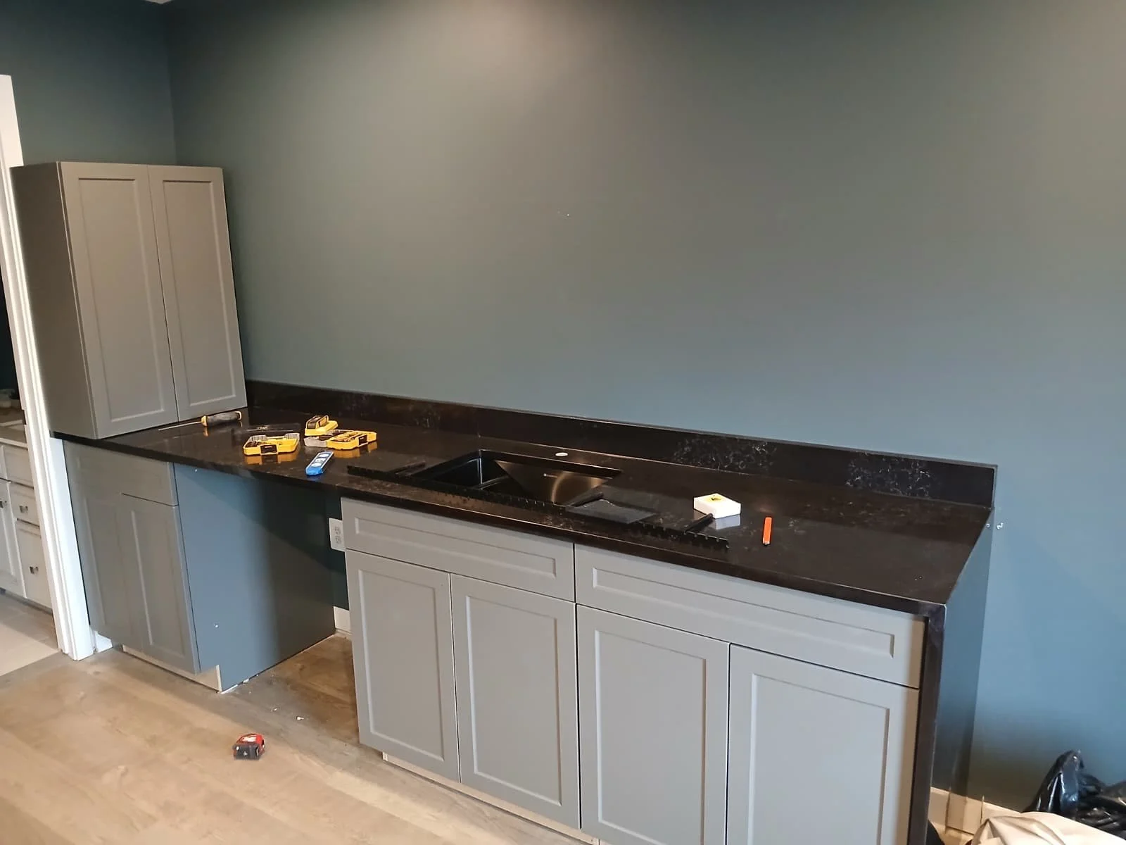 Custom Bar & Cabinetry Installation – Interior Renovation

This project features a fully custom-built bar and cabinetry installation designed to combine modern aesthetics with everyday functionality. The space includes custom gray shaker-style cabine