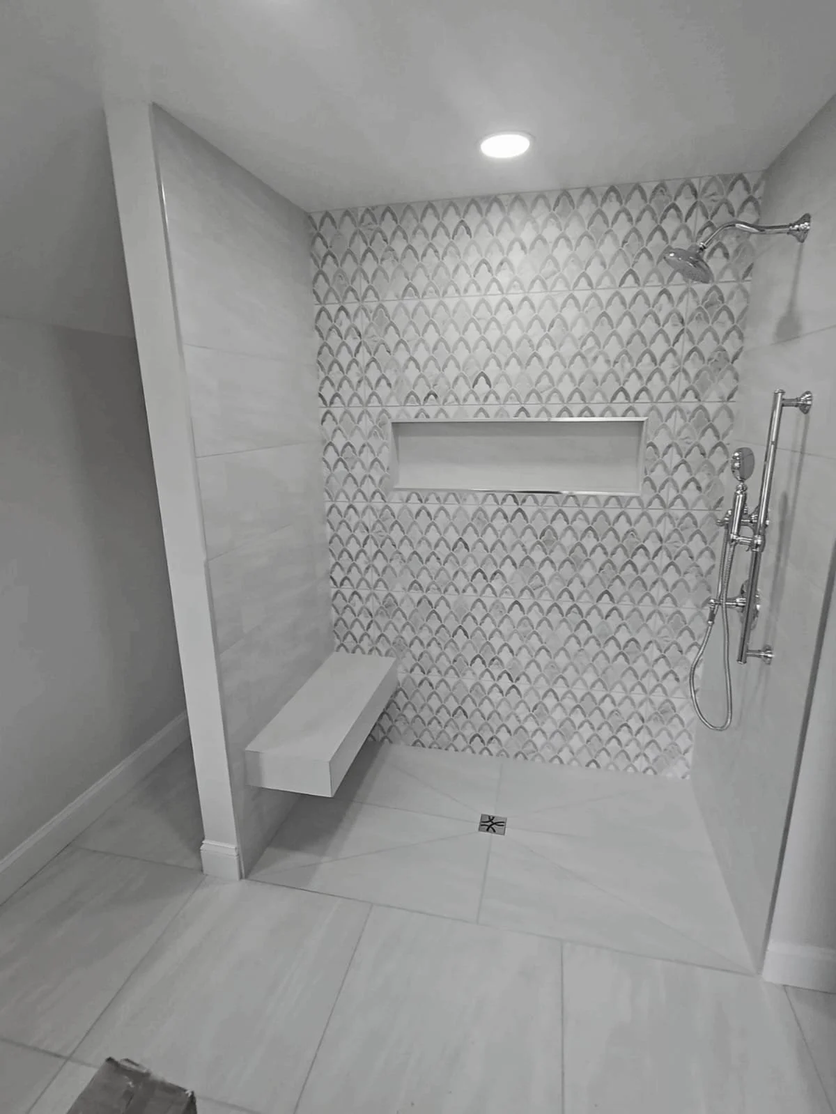 Contemporary bathroom vanity with custom mirror and lighting. High-end cabinetry and professional installation in Hyattsville, Maryland.