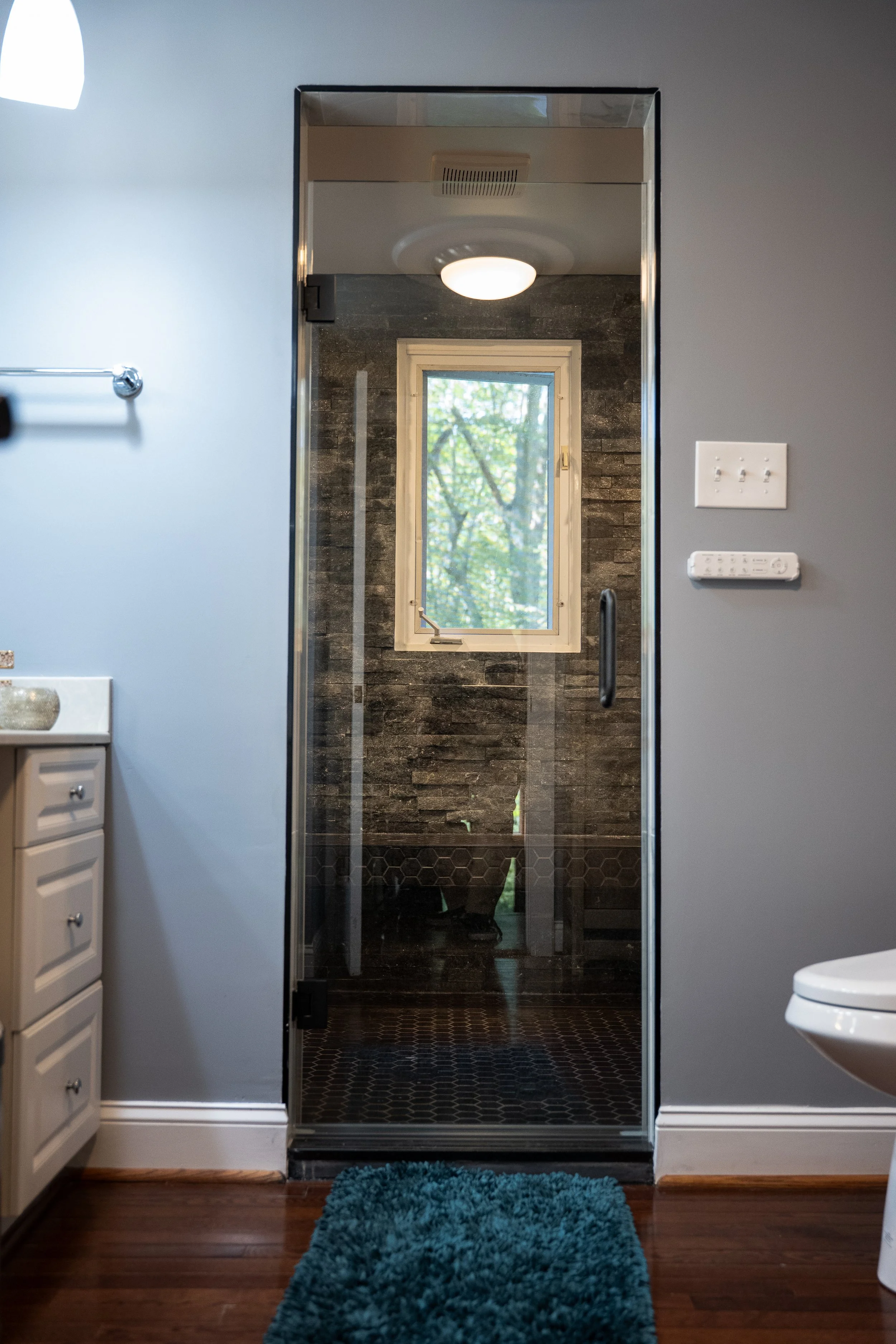 Minimalist bathroom sink with professional faucet fitting. Clean lines and superior finishes for modern homes in Bethesda.