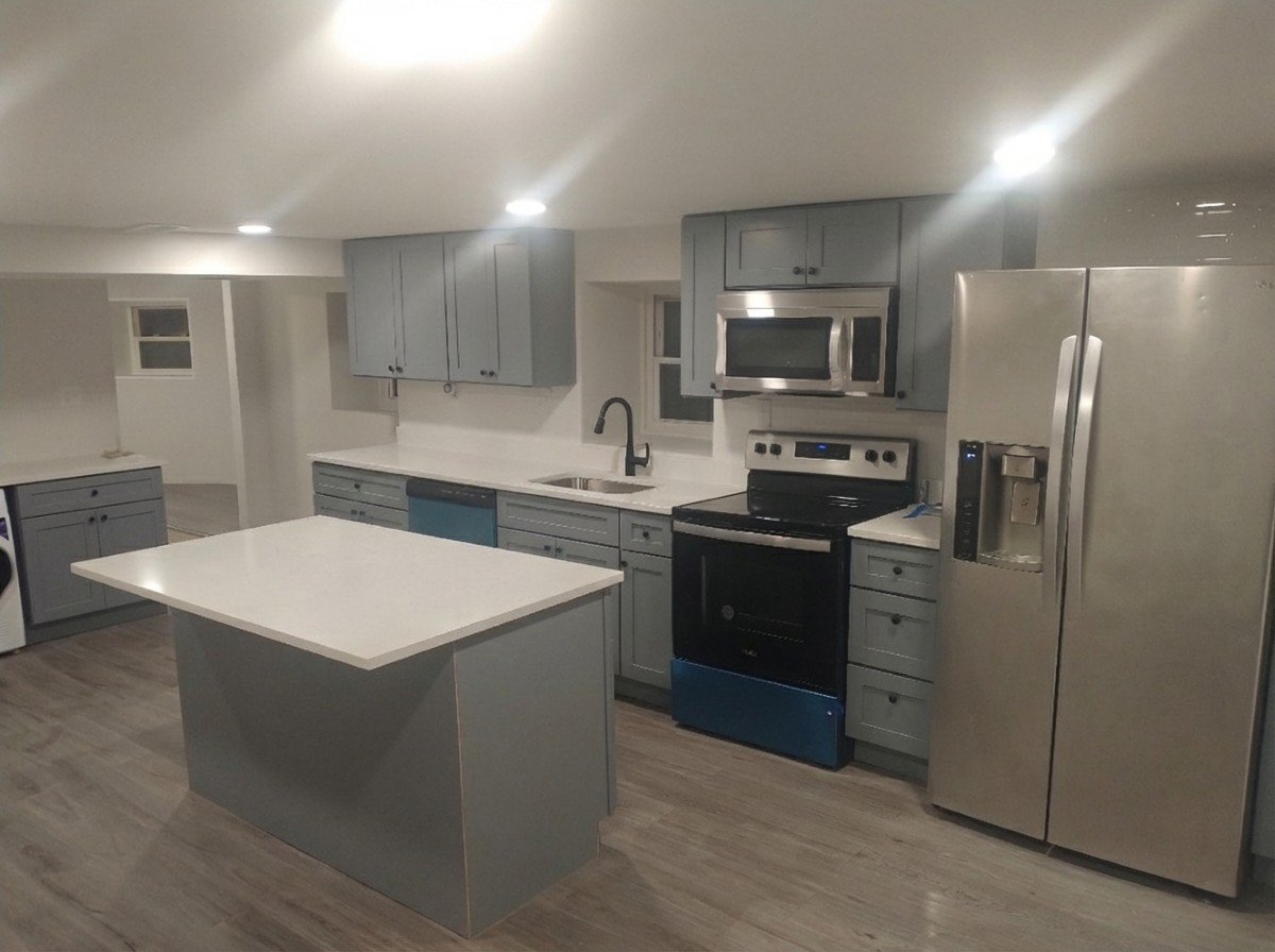 Contemporary kitchen sink area with sleek white tile backsplash and quartz surfaces. Expertly designed for luxury homes in Ellicott City, MD.