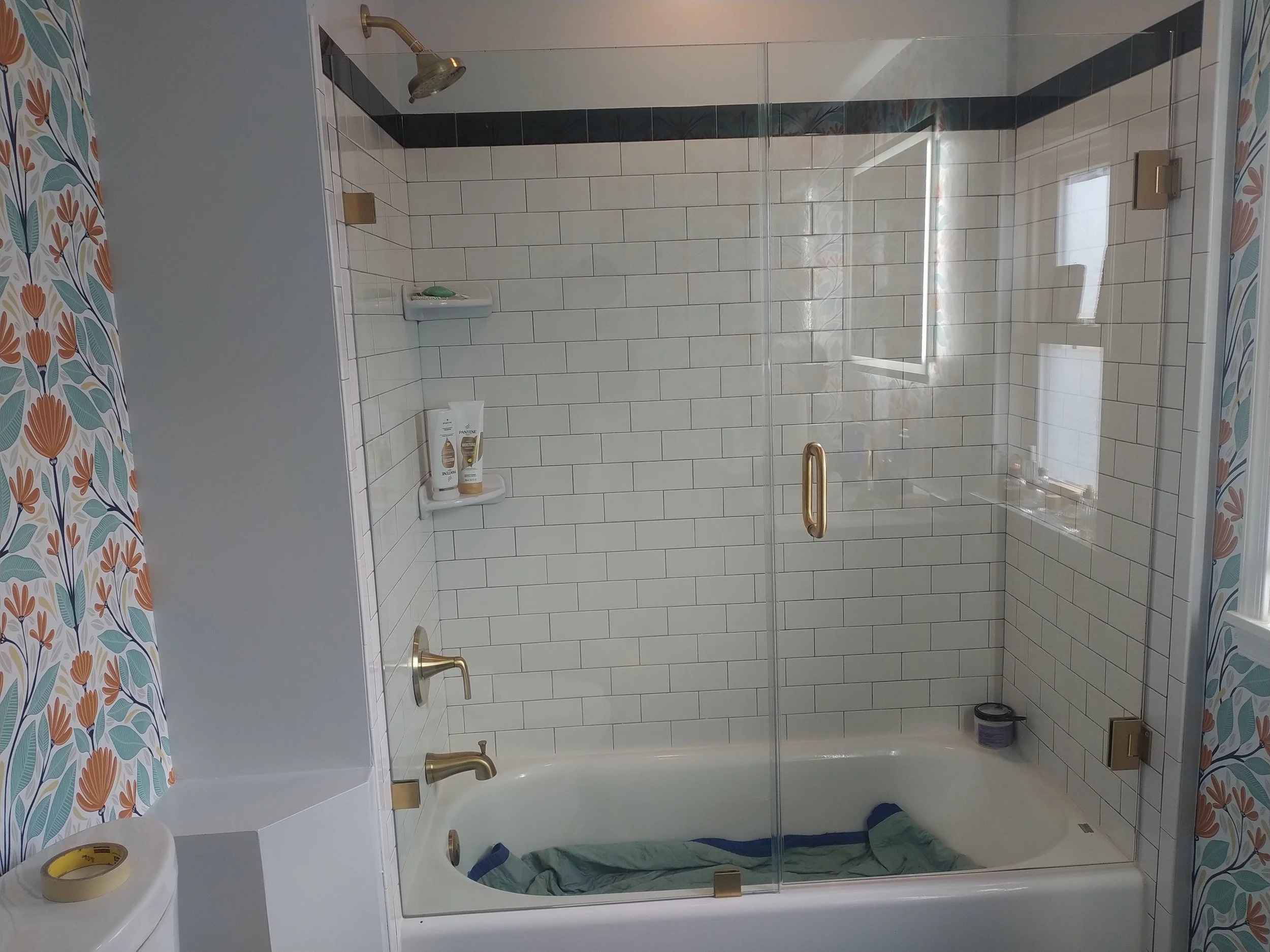 Luxury walk-in shower featuring seamless glass enclosure. High-end tile work and professional finishing in Lakewood, New Jersey.