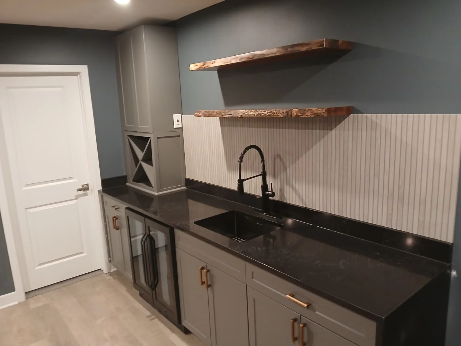 Custom Bar & Cabinetry Installation – Interior Renovation

This project features a fully custom-built bar and cabinetry installation designed to combine modern aesthetics with everyday functionality. The space includes custom gray shaker-style cabine