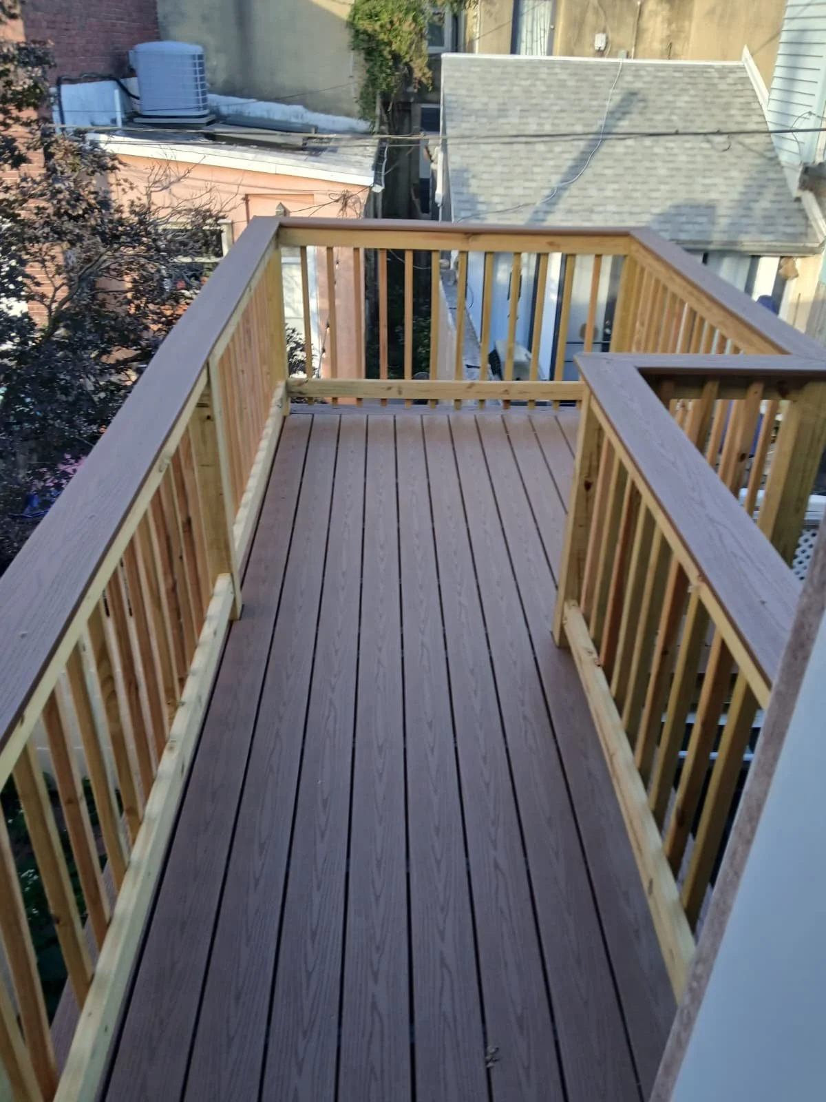 Custom wood deck construction project in Middletown. High-quality pressure-treated lumber and professional framing. Custom Deck, Roof Deck, Vinyl Hand rails, composite boards, door deck, deck builder, deck engineering, deck builder in NYC, deck build