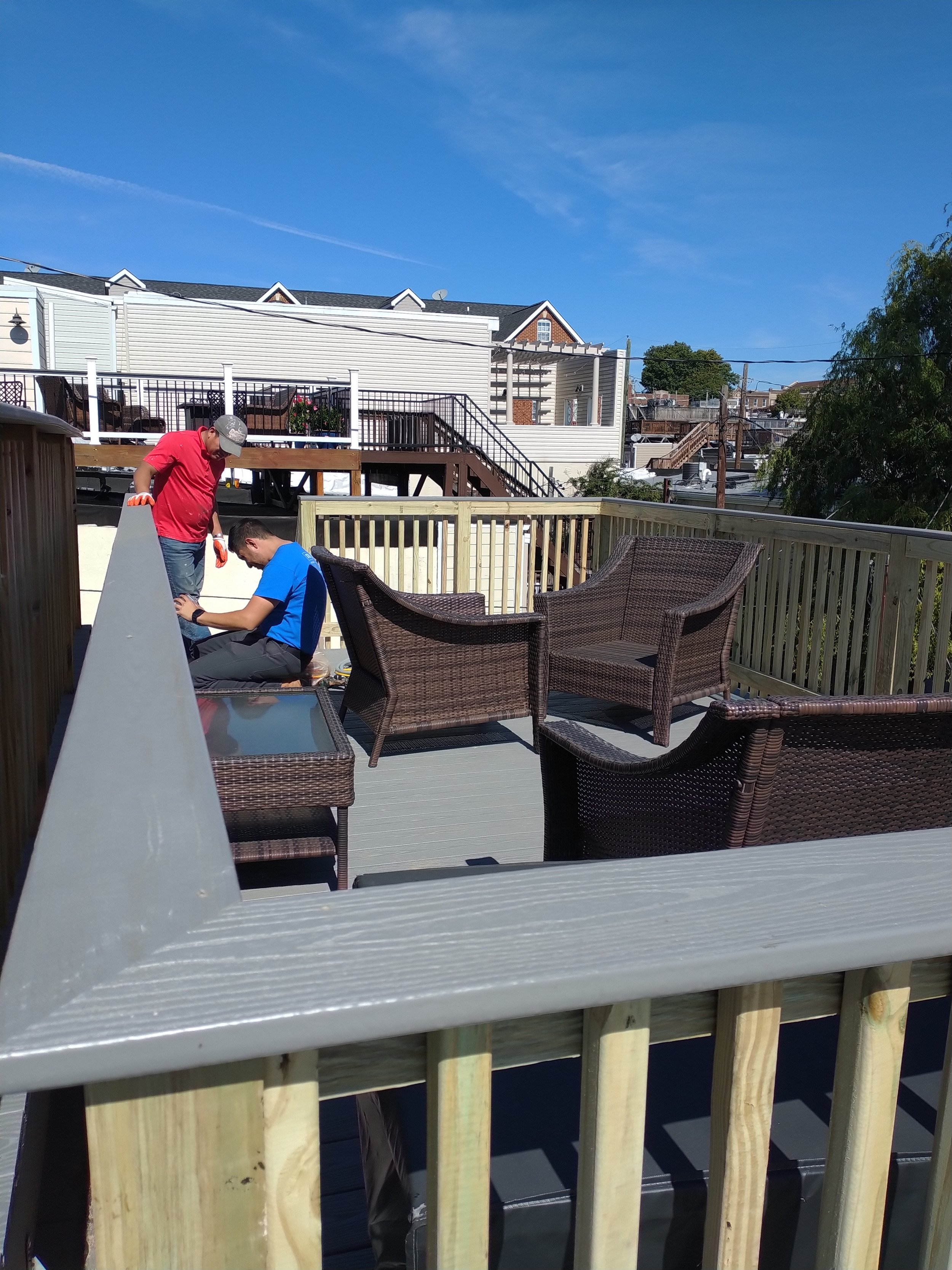 Precision deck floor board installation and spacing. High-end outdoor living space transformation in Bushwick.