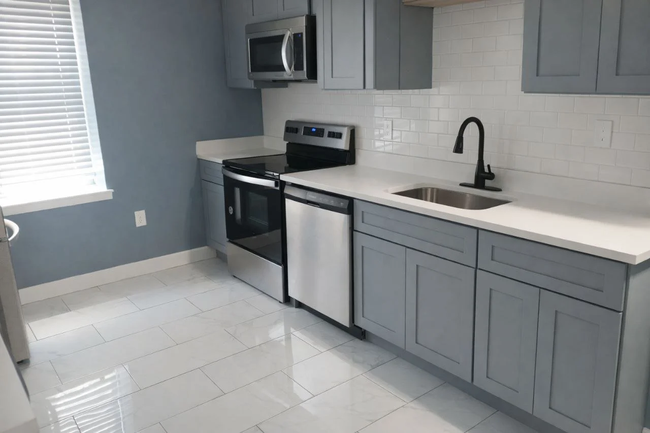 Open-concept kitchen renovation featuring a custom central island. Expert space planning and premium materials by Elite Craft in Potomac Park.