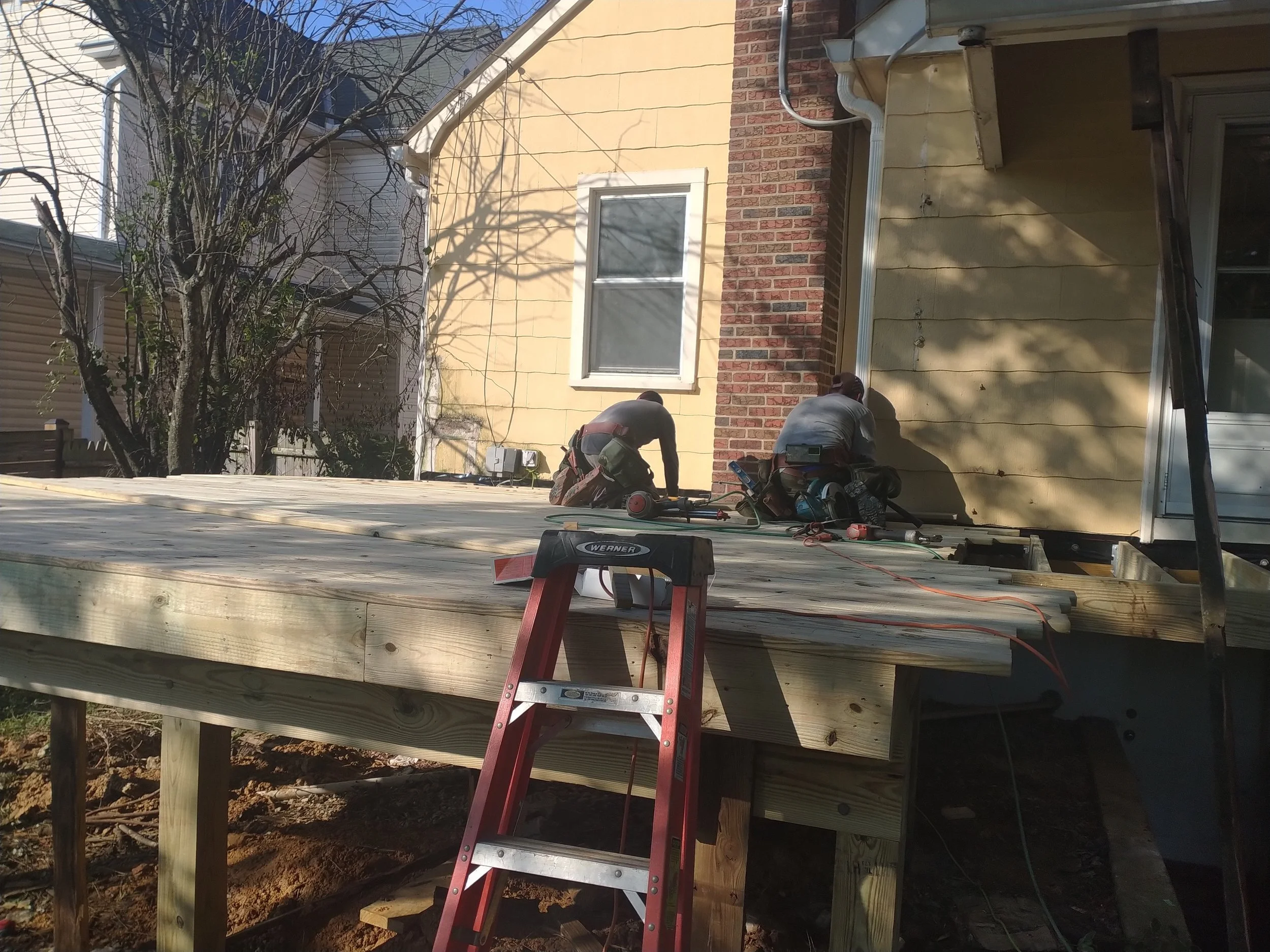 Structural elevated deck framing with pressure-treated lumber. Expert outdoor construction in Point Pleasant Beach, NJ. Custom wood deck construction project in Middletown. High-quality pressure-treated lumber and professional framing. Custom Deck, R