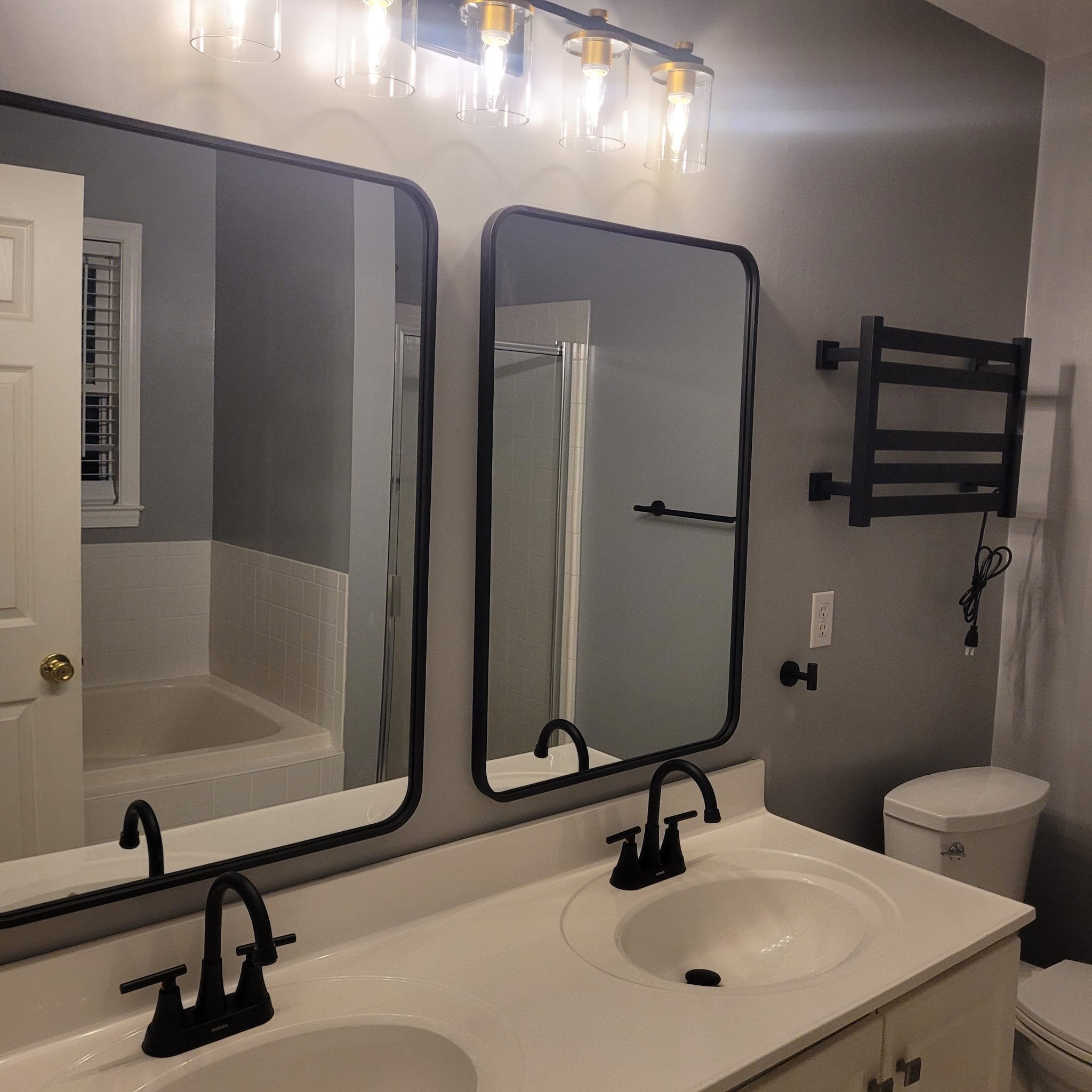 High-end walk-in shower with seamless glass enclosure. Professional tiling and contemporary design in Red Bank, New Jersey.
