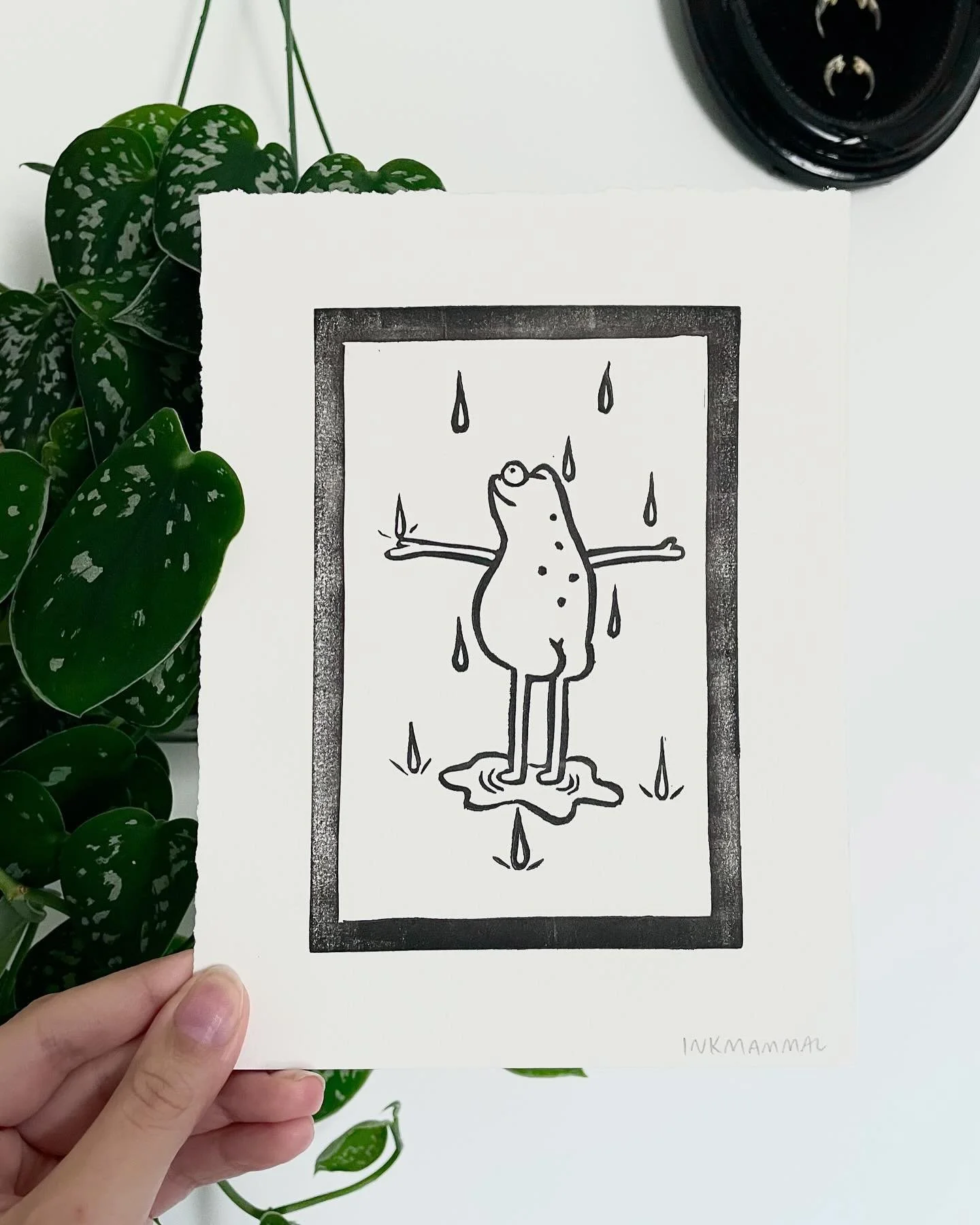 In time for April Showers, this is the newest addition to my silly little frog linocut series, and it&rsquo;s now up in the shop. It&rsquo;s his favorite time of year, he loves the rain. 🐸🌧️

#frog #print #handmade #frogart #linocut #linocutprint #
