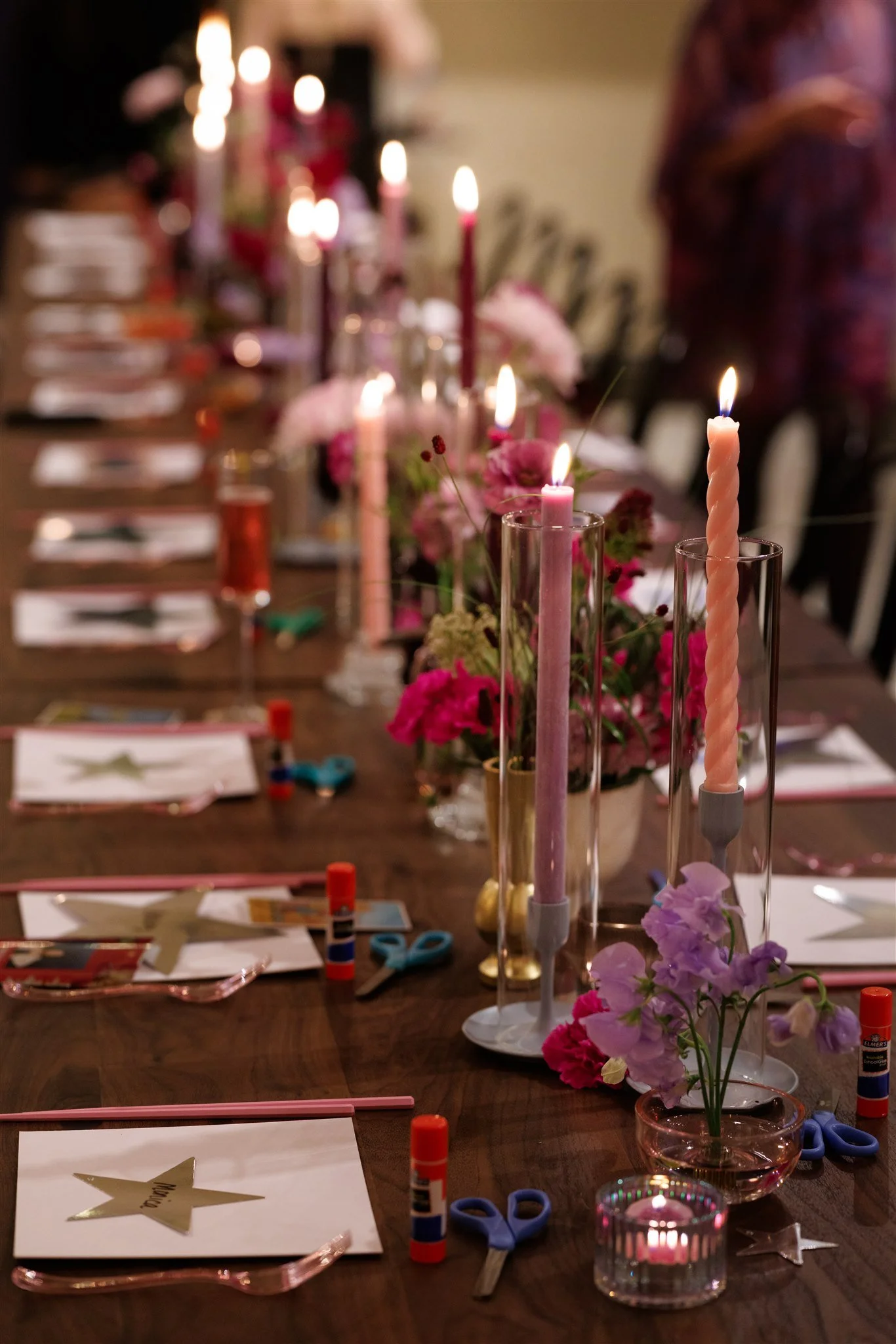 Brand activation event setup at Joyful Commons historic venue in Homestead PA — candlelit tables with florals, craft supplies, and pink accents perfect for creative workshops and experiential brand events near Pittsburgh.
