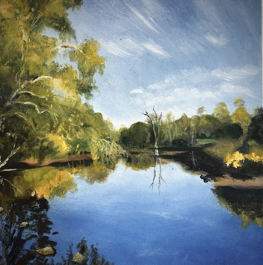 A landscape painting of a calm river surrounded by green trees with a partly cloudy blue sky reflected on the water.