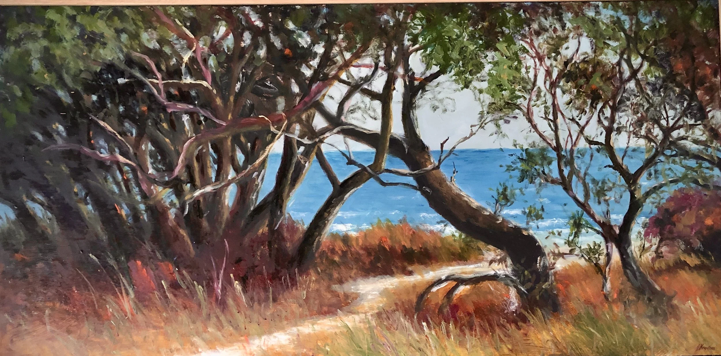 A painting of a coastal landscape with windswept trees and a dirt path leading to the ocean, with blue water and sky in the background.