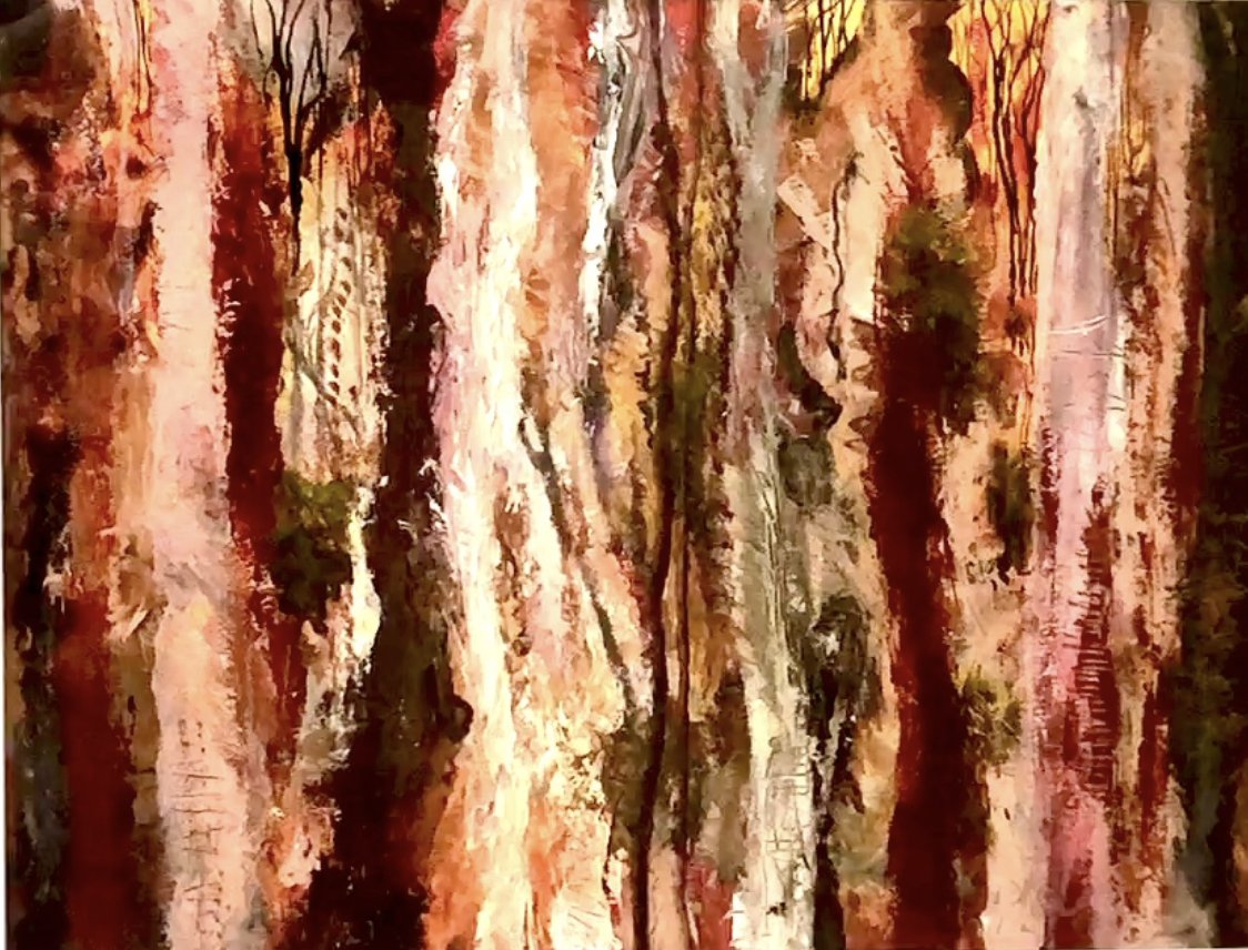 Close-up of a tree bark with multiple vertical stripes of beige, white, brown, and reddish hues, showing textured and cracked bark with some small green moss patches.