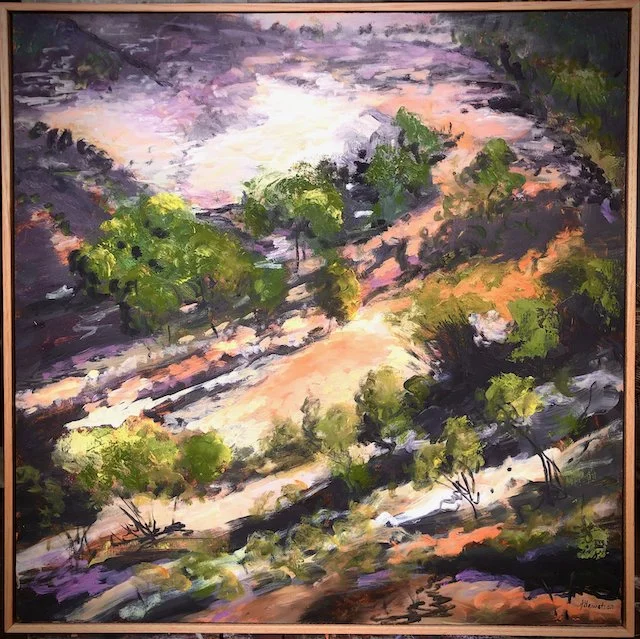 An impressionist landscape painting of a hilly terrain with green trees, a winding dirt path, and distant mountains under a partly cloudy sky.