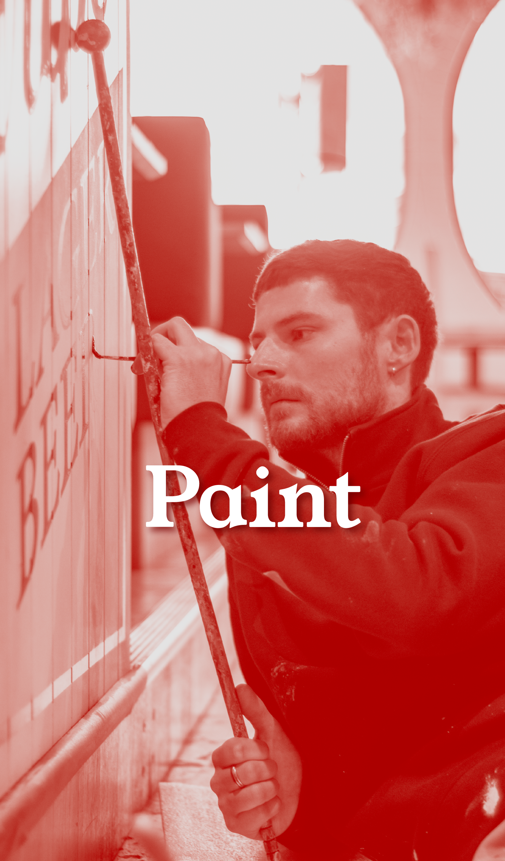 A man painting a wall using a brush, with the word 'Paint' overlaid on the image.