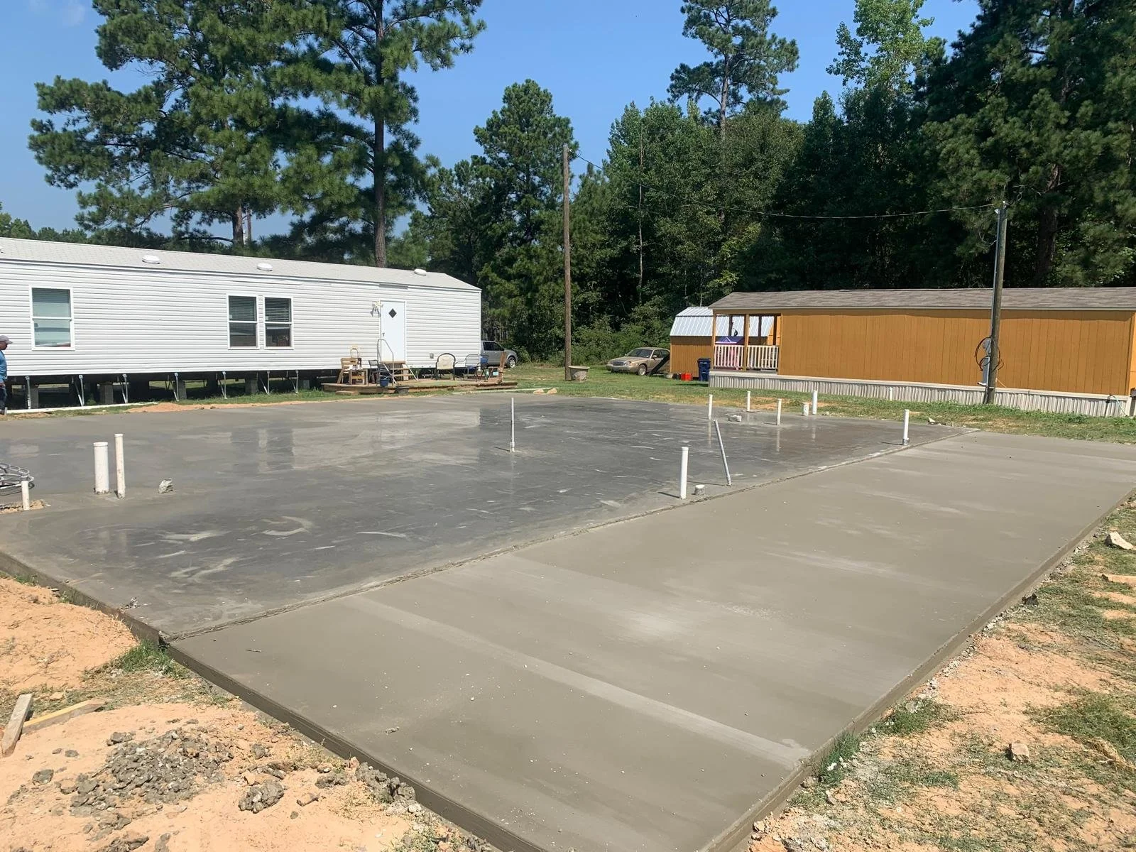 Freshly poured concrete foundation in a residential area