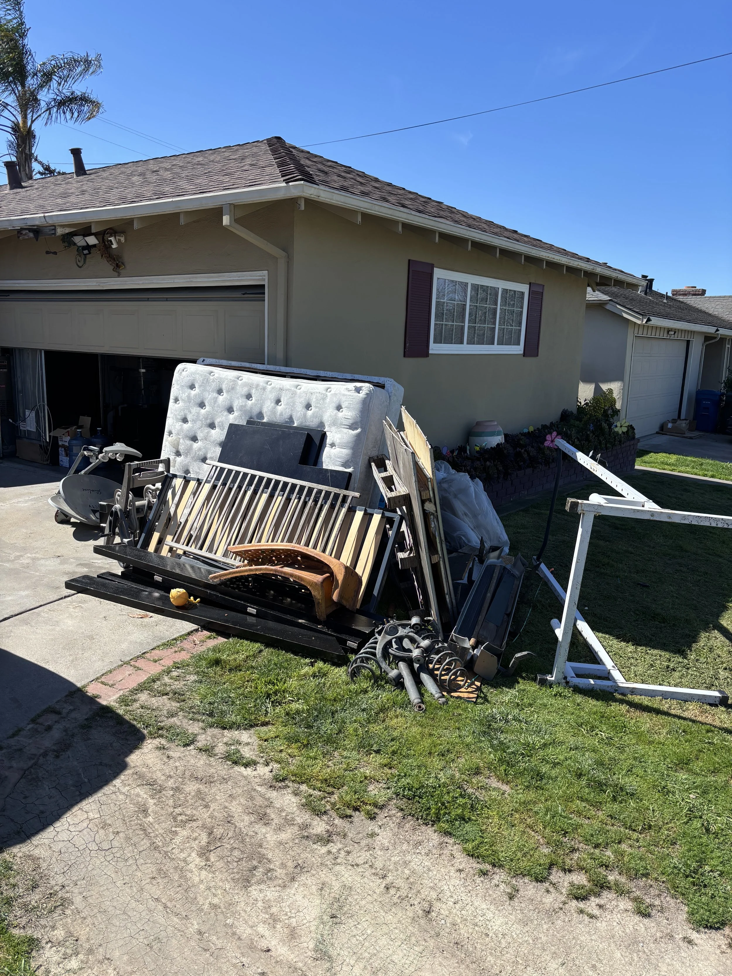 Junk Boys hauling away a full load of junk from a residential cleanup in Marina CA