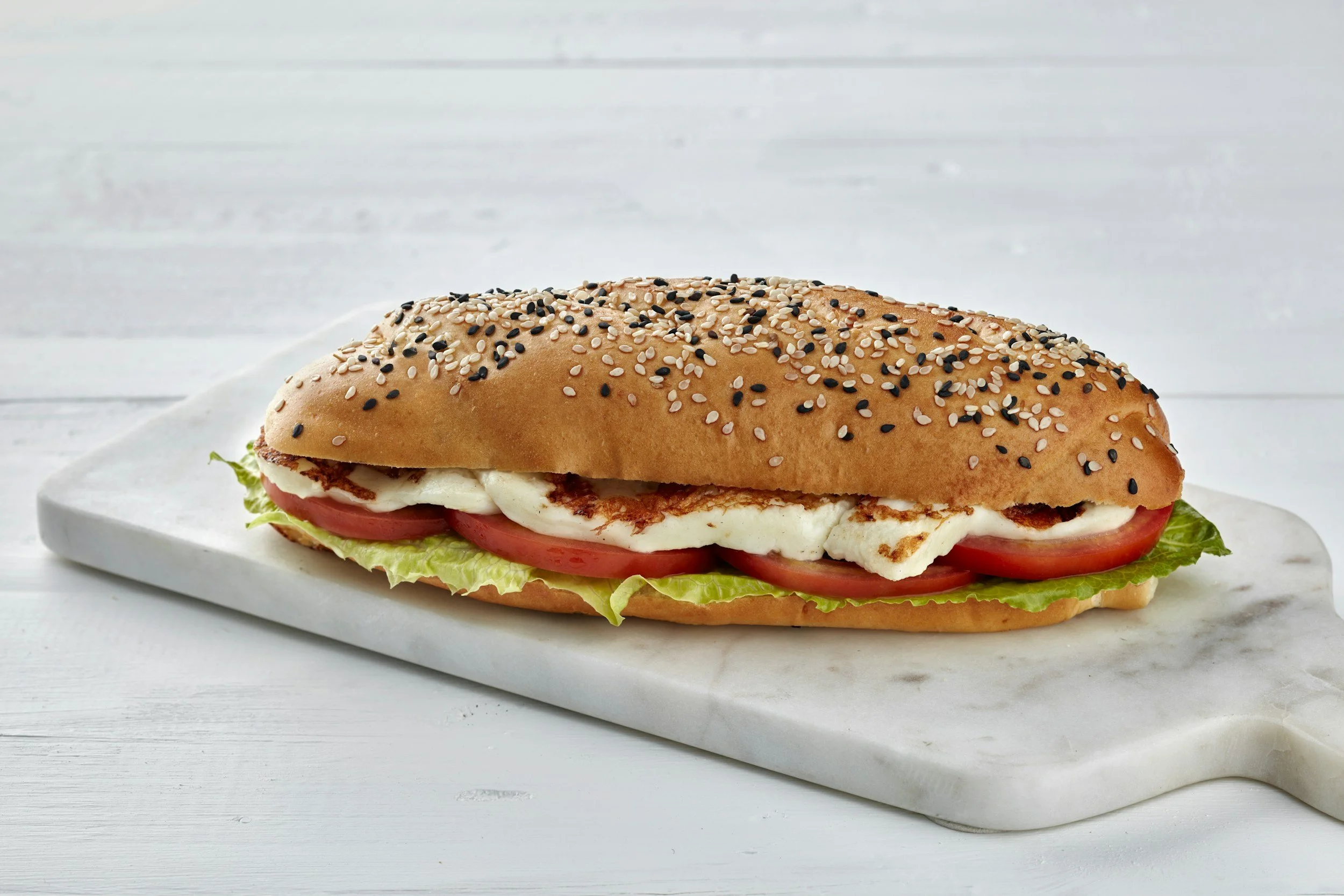 A submarine sandwich on a platter