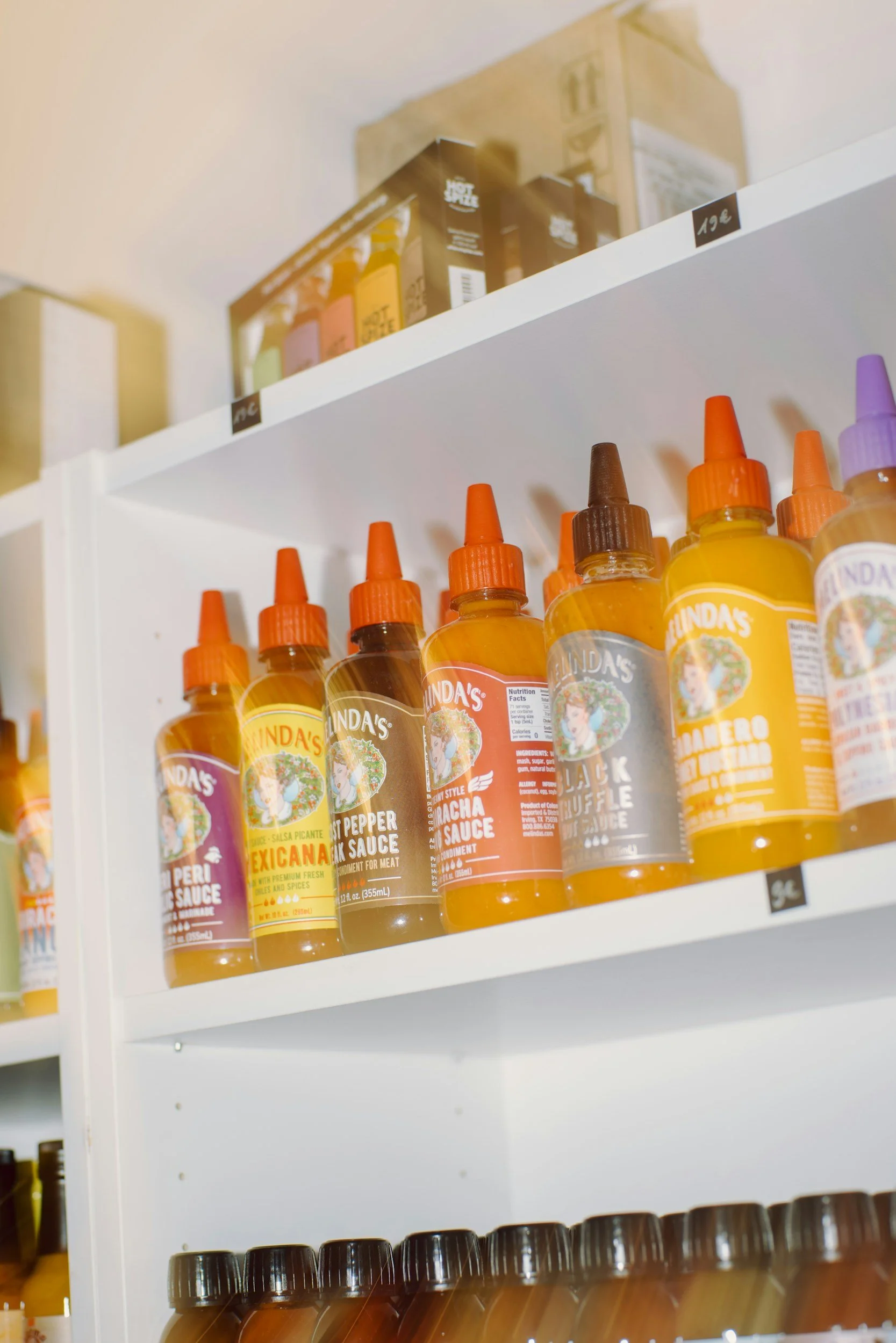 Shelf of different hot sauces