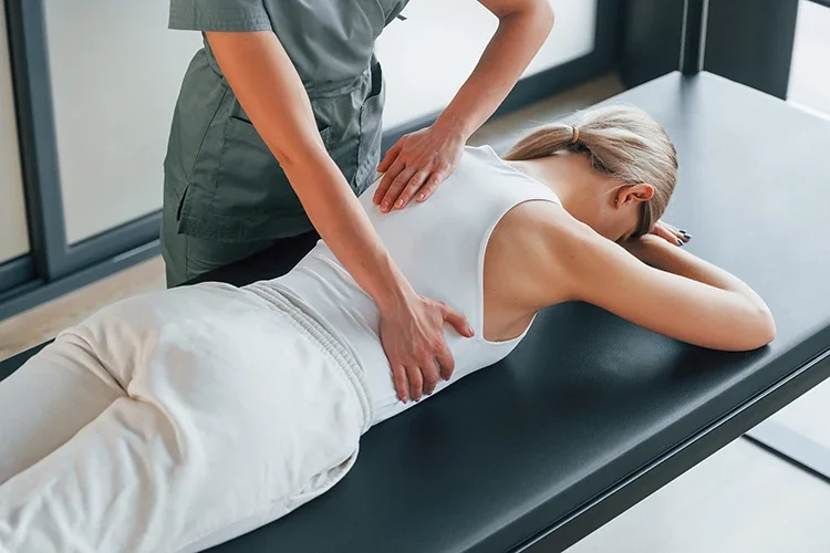 A chiropractor performing a spinal adjustment on a patient to provide pain relief, correct posture, and enhance overall body mobility.