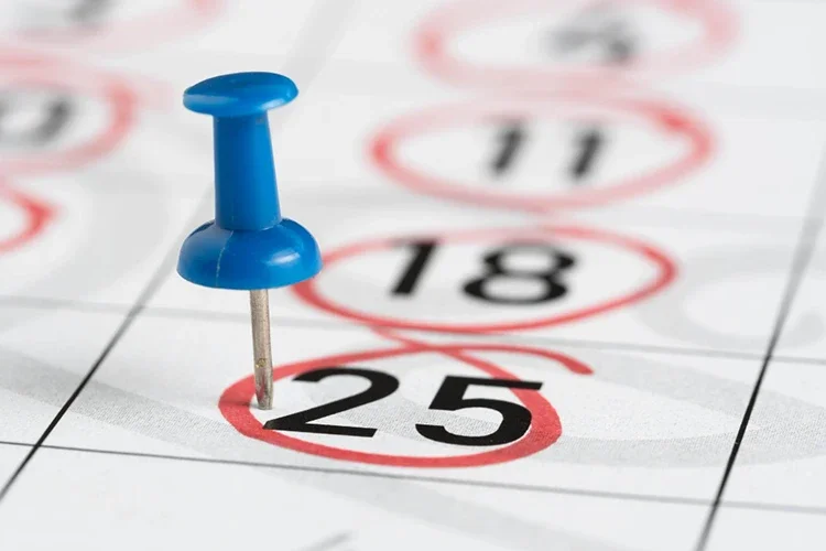 A close-up of a calendar with multiple dates marked with red circles, symbolizing chronic pain that lasts longer than 3 months.