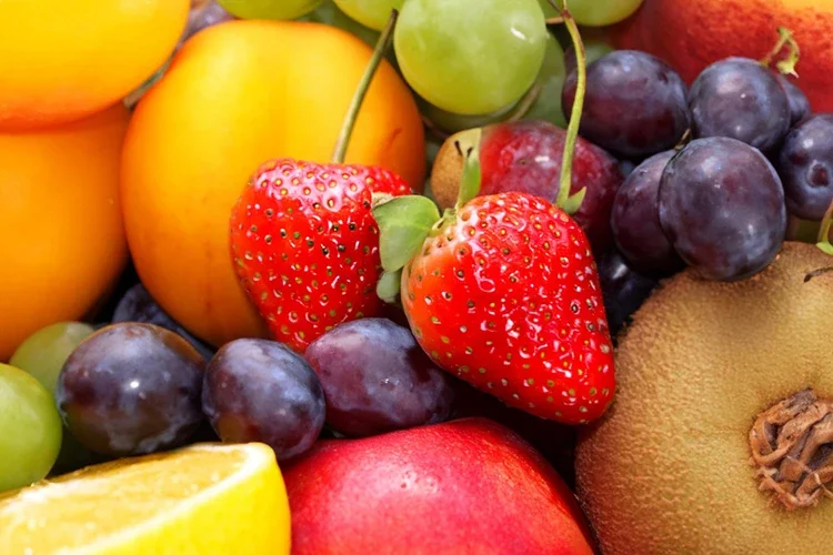 A vibrant medley of fresh fruits like strawberries, grapes, kiwis, and oranges. These natural treats are portrayed as an easy, portable source of vitamins and fiber, perfect for boosting energy and immunity on the go.