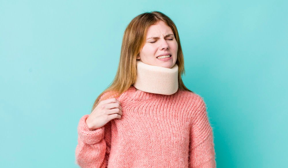 A photo of a woman wearing a neck brace due to whiplash injury