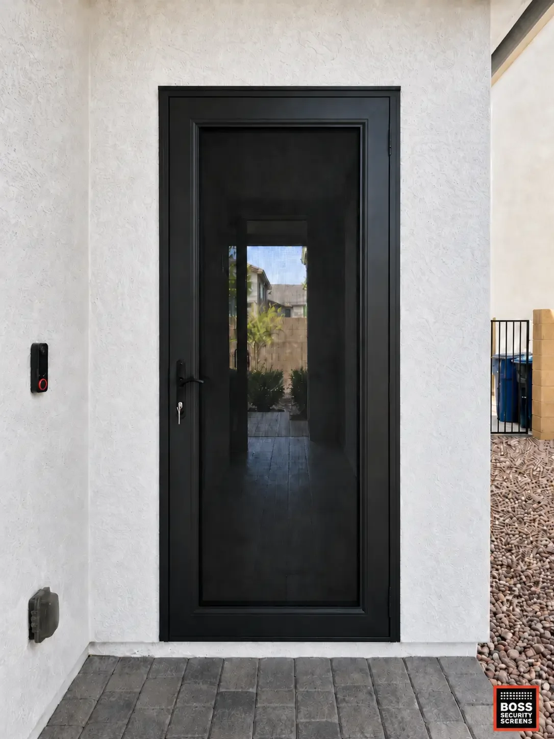 black-full-mesh-single-hinged-security-screen-on-stucco-entryway.webp