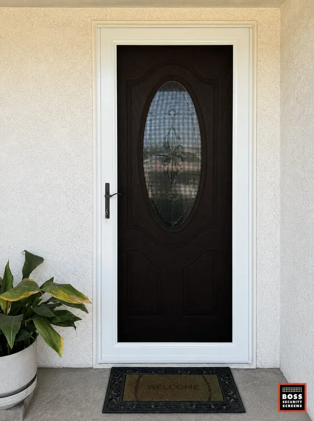white-security-screen-over-oval-glass-front-door-with-potted-plant.webp