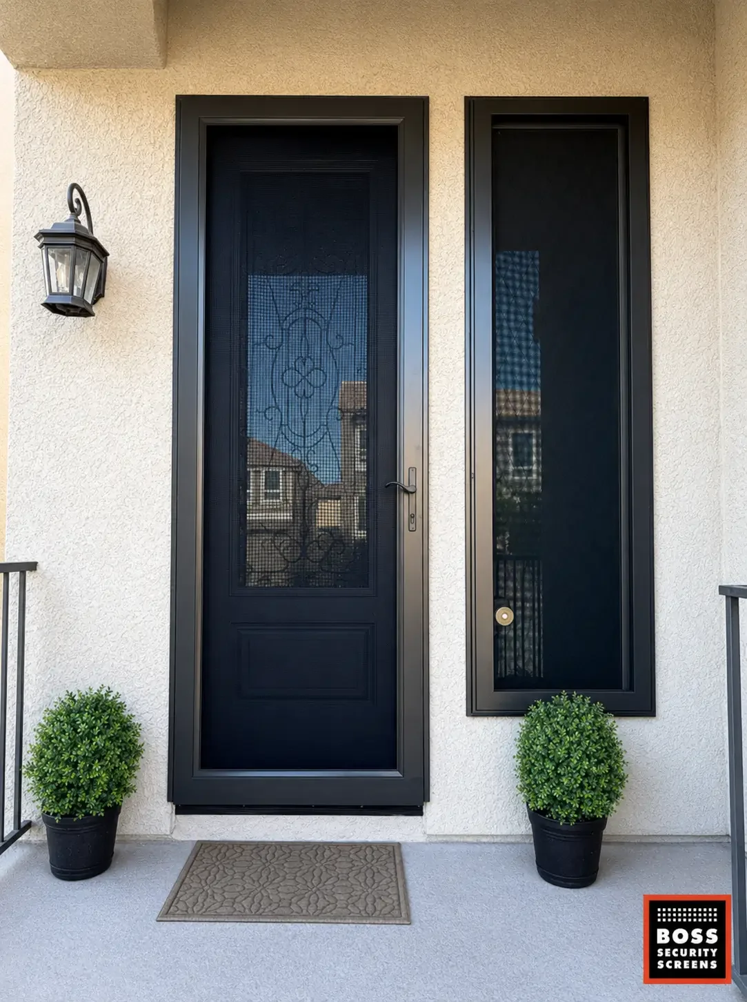 black-single-hinged-security-screen-with-matching-side-insert-and-potted-plants.webp