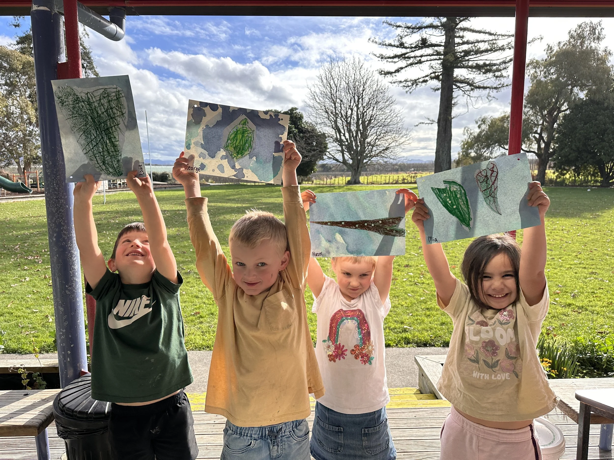4 students with their Matariki Leaf Map