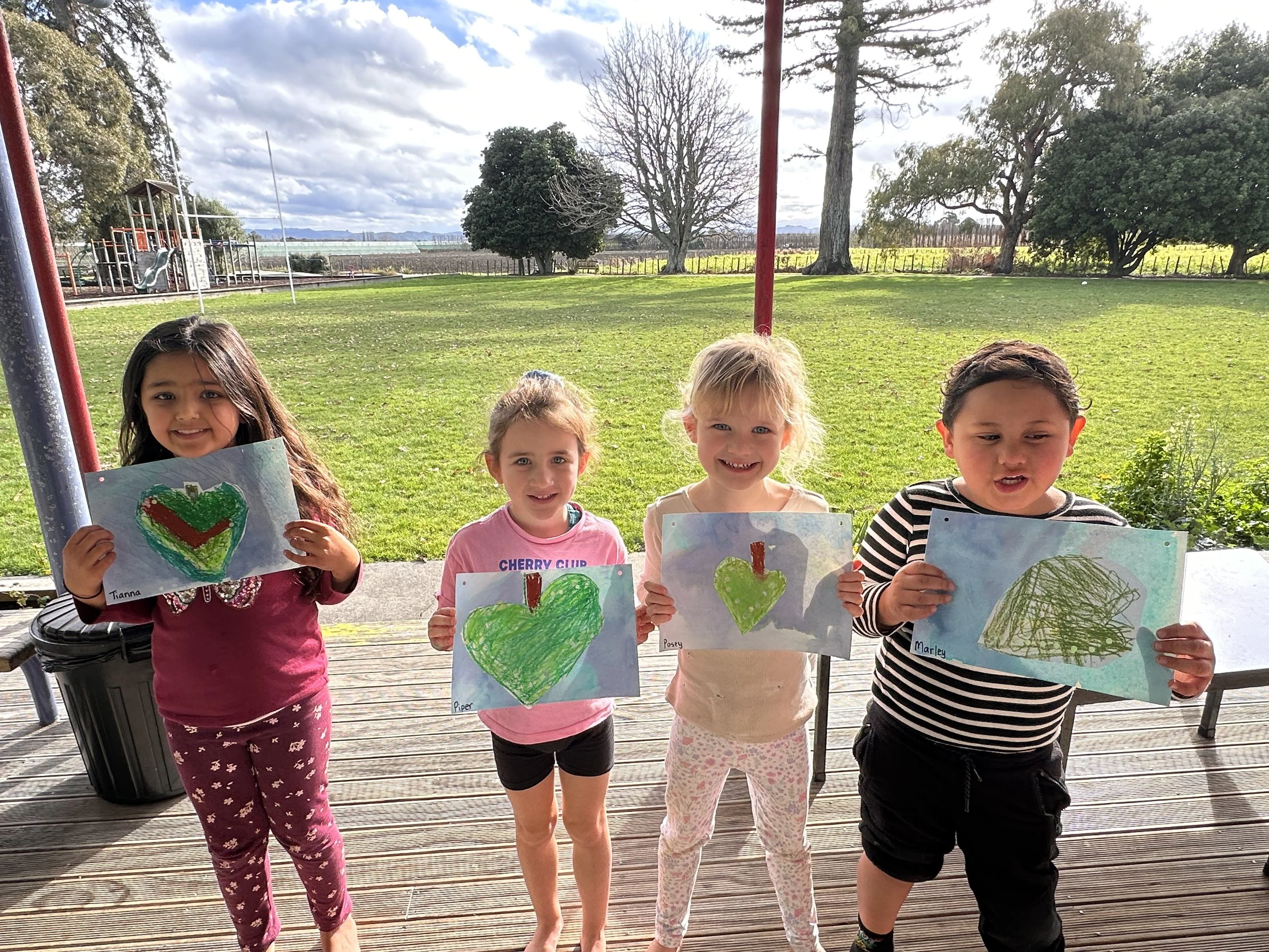 4 students with their Matariki Leaf Map