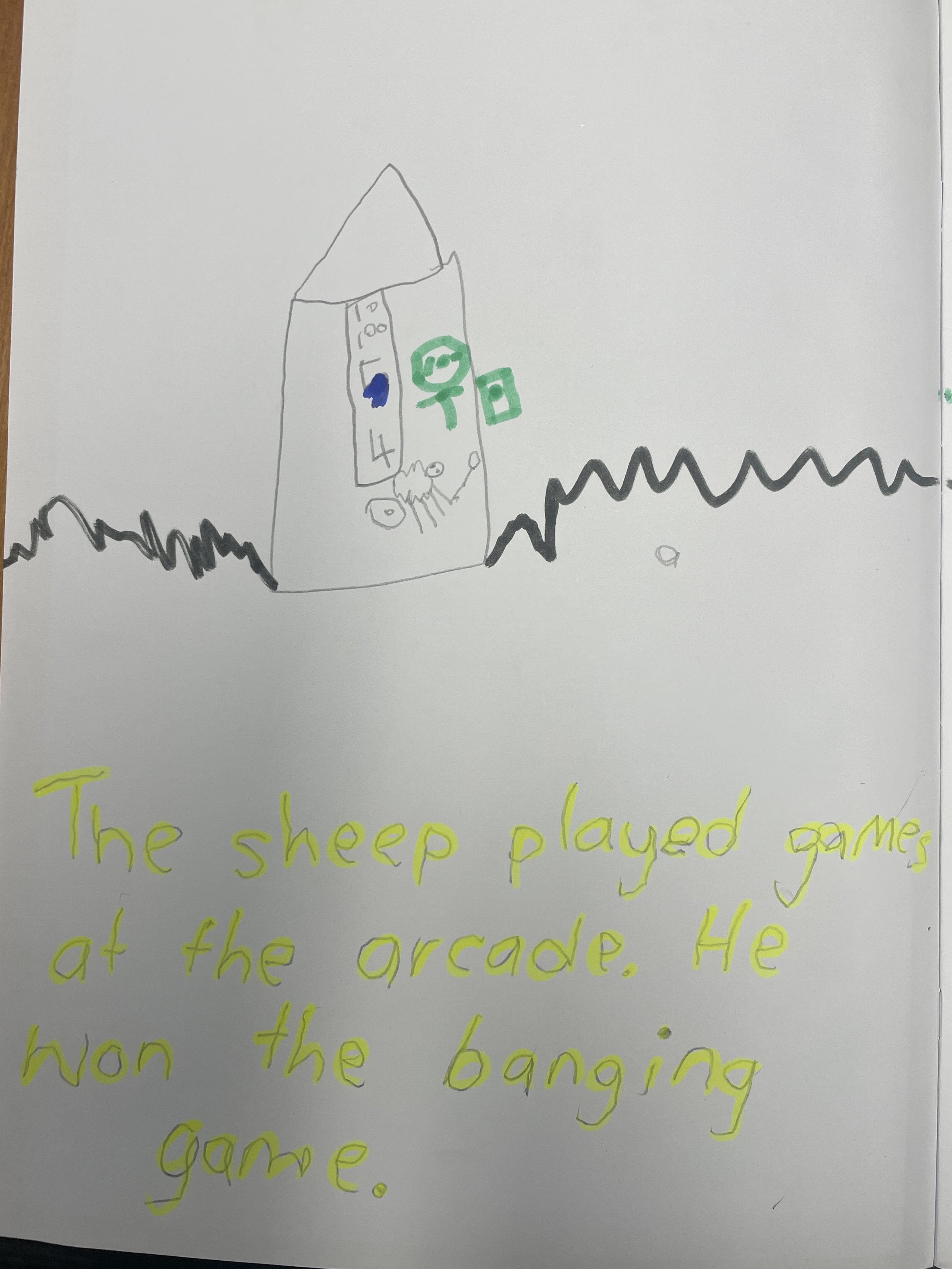 Student writing about Sheepy at the arcade