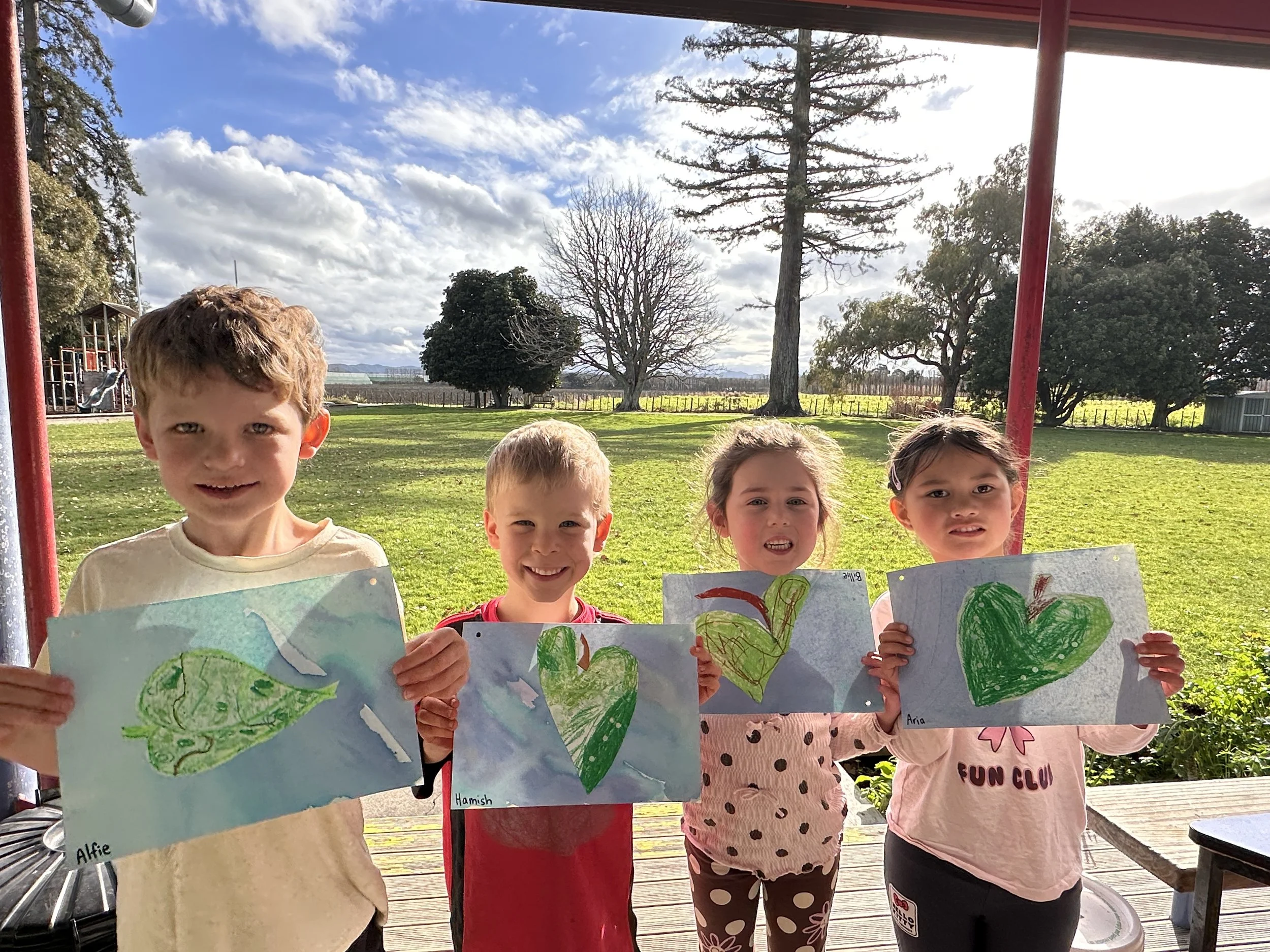 4 students with their Matariki Leaf Map
