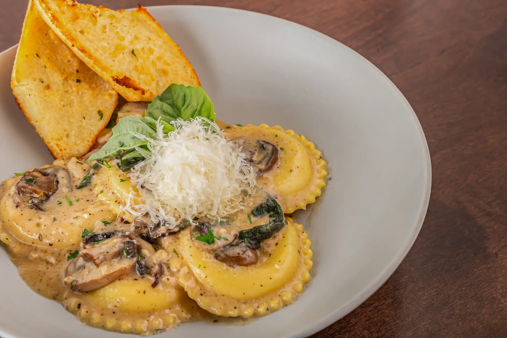 Four cheese ravioli with cremini mushrooms