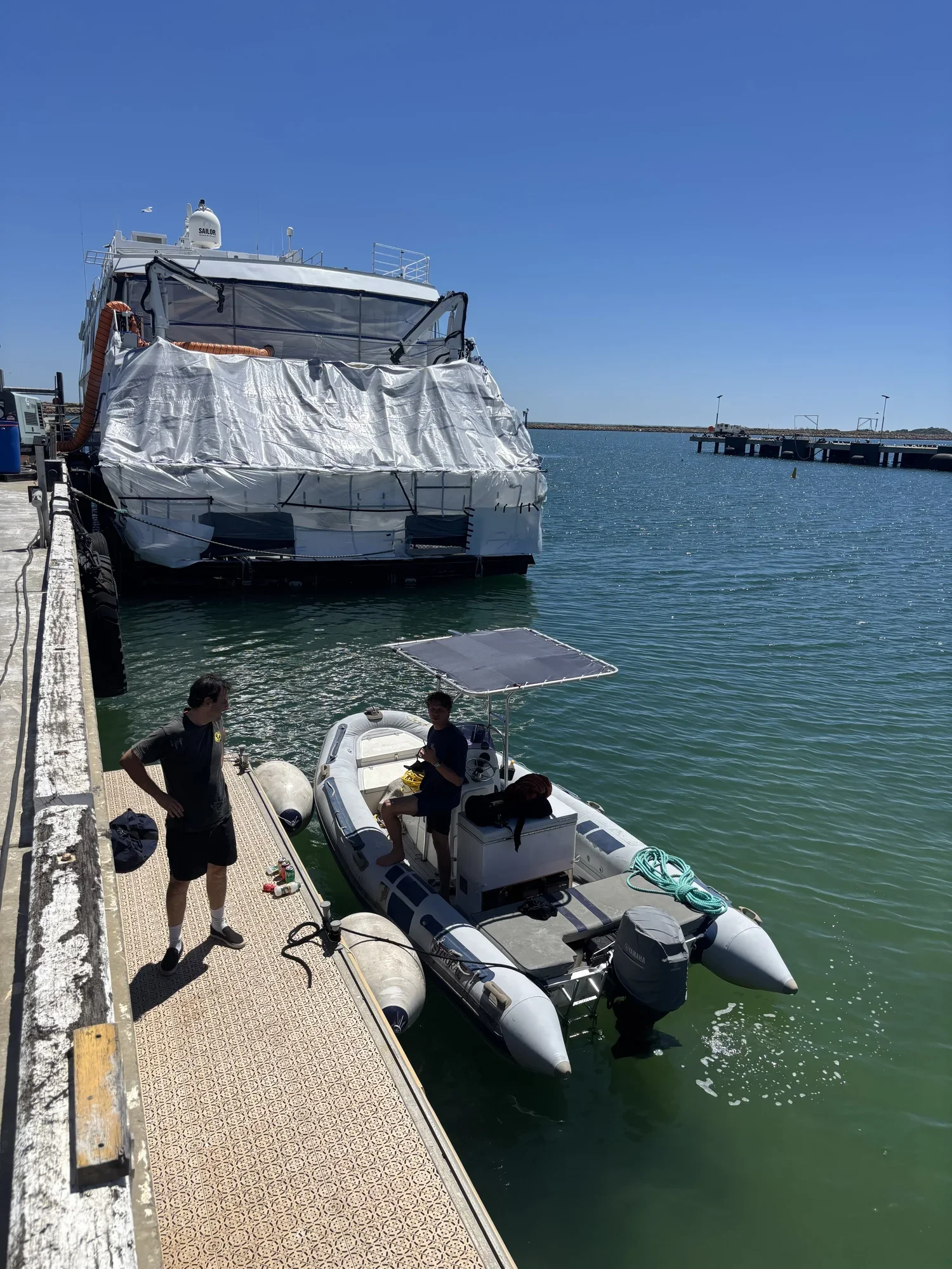 Wet Water WA divers preparing for an in-water hull clean on a moored vessel in Perth